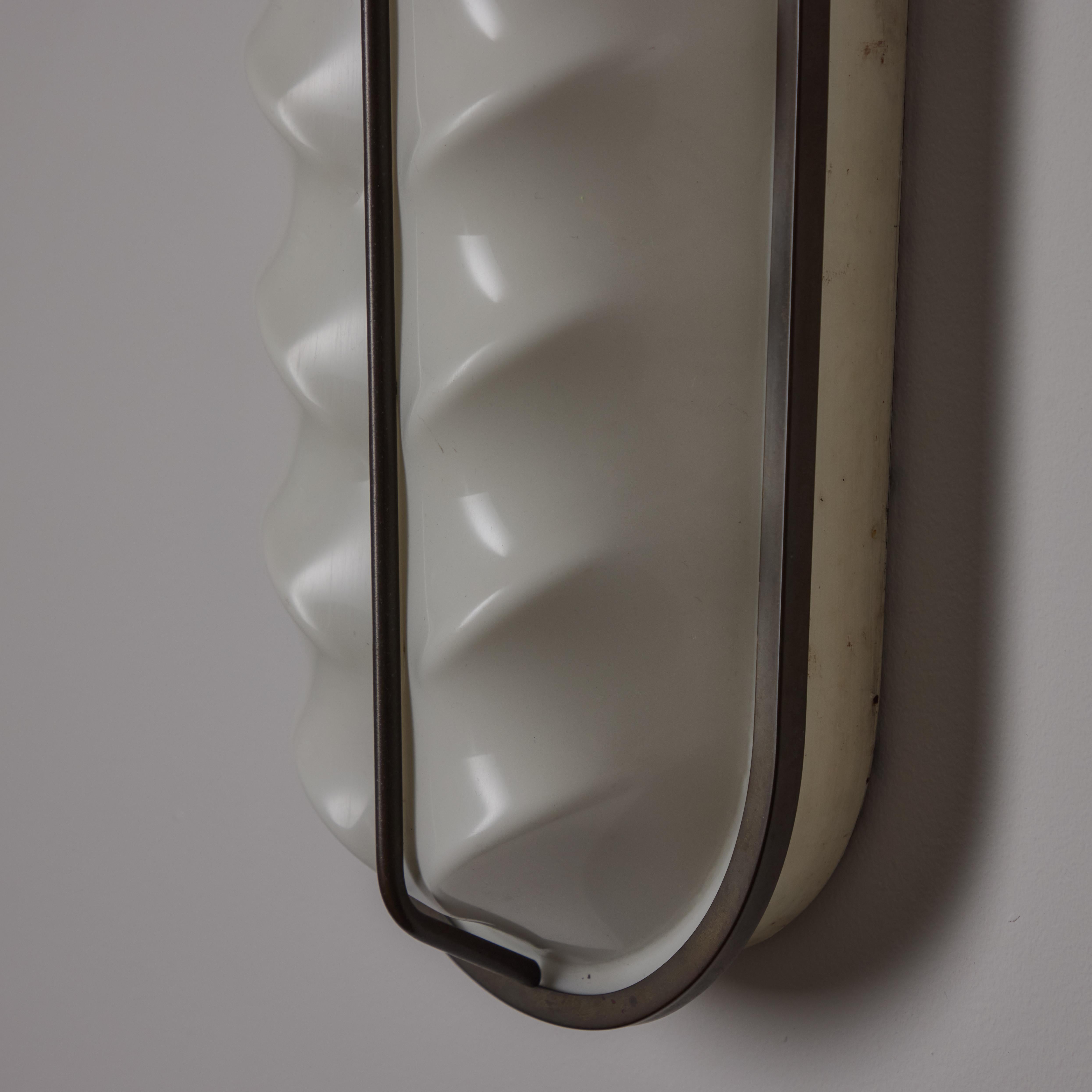 A Pair of Sconces by Stilux 1