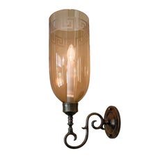 A Pair of Sconces with Amber Etched Hurricane Shades