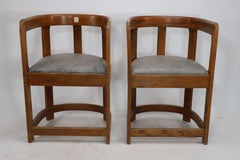 A pair of Scottish School armchairs of barrell form