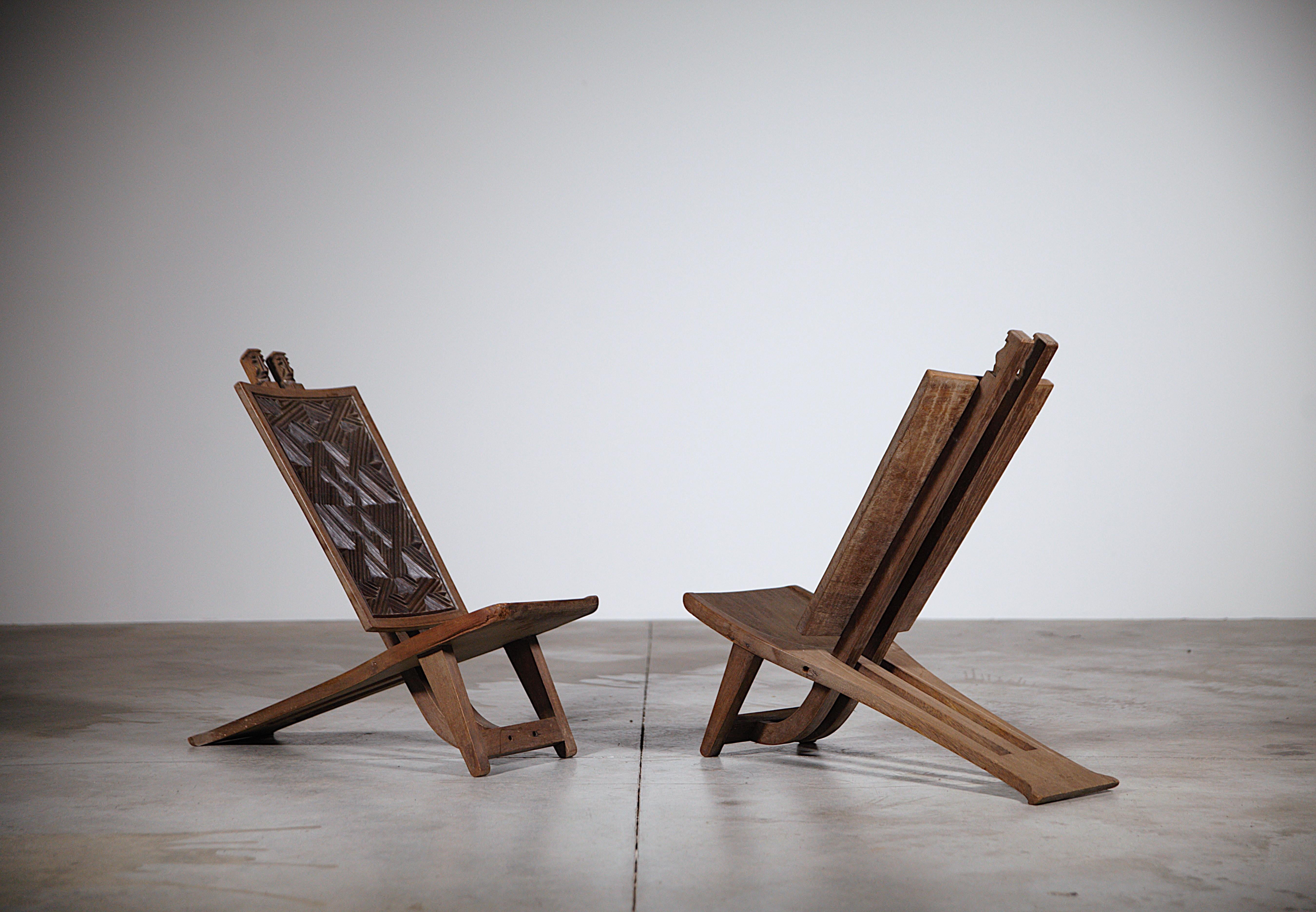 A pair of African sculpted lounge chairs Africa 1970s.

Exotic wood.

In good condition.

Report : trace of use in the corner of a seating ( please refer to the last photo ).