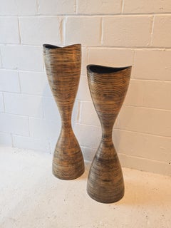 A Pair of Sculptural Hourglass Wooden Planters