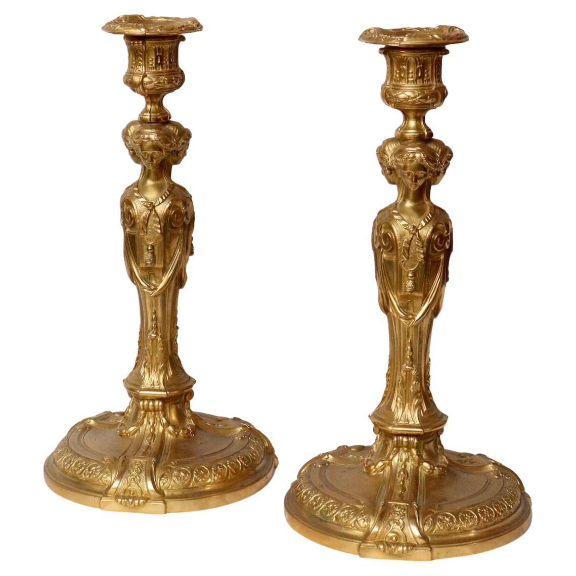 A Pair of Second Half 19th Century French Ormolu Candlesticks 
After the Model by Francois Rémond to a design By Jean-Demosthene Dugourc
Each with a stiff leaf decorated shaft modelled with four addorsed classically-dressed female herms and