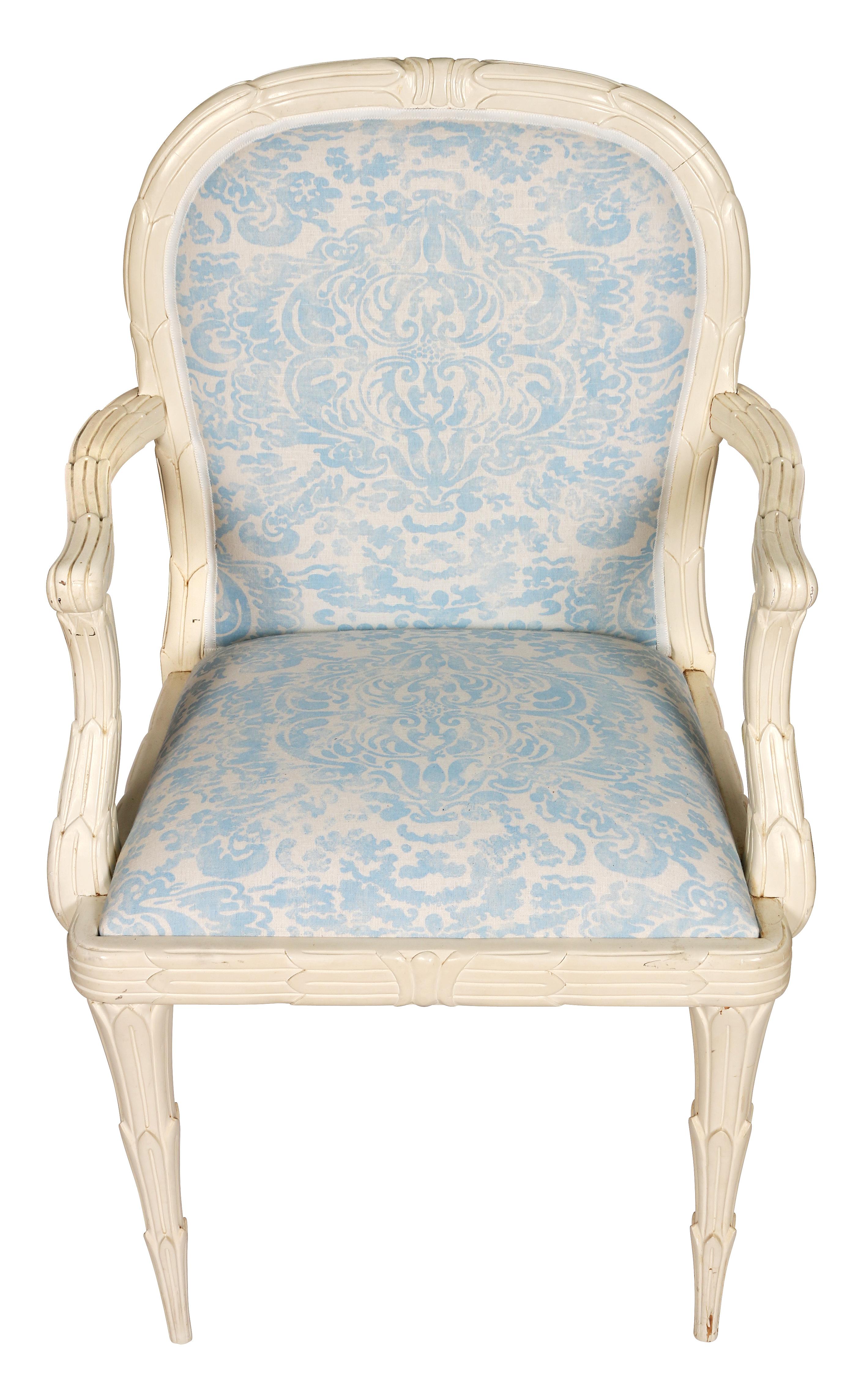 A pair of white Serge Roche armchairs recently reupholstered in China Seas pale blue floral fabric.