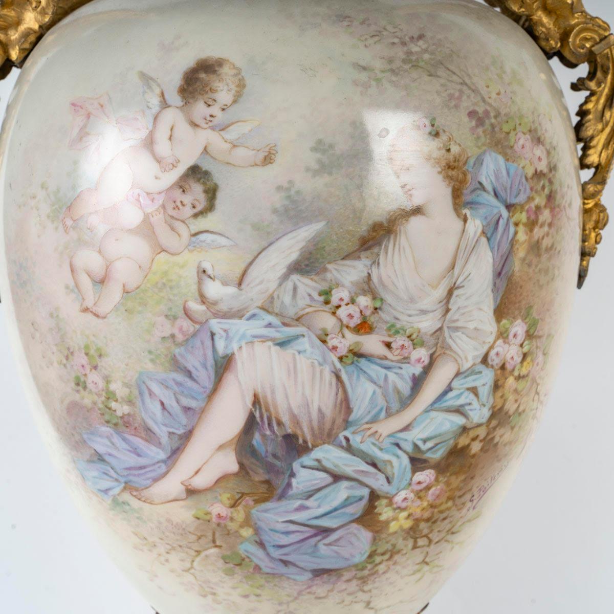 A pair of Sèvres porcelain covered vases, 19th century, Napoleon III period.

A pair of Napoleon III period covered vases in Sèvres porcelain, enamelled and gilded, gilt bronze mount, decorated with angels, paintings of romantic scenes, large