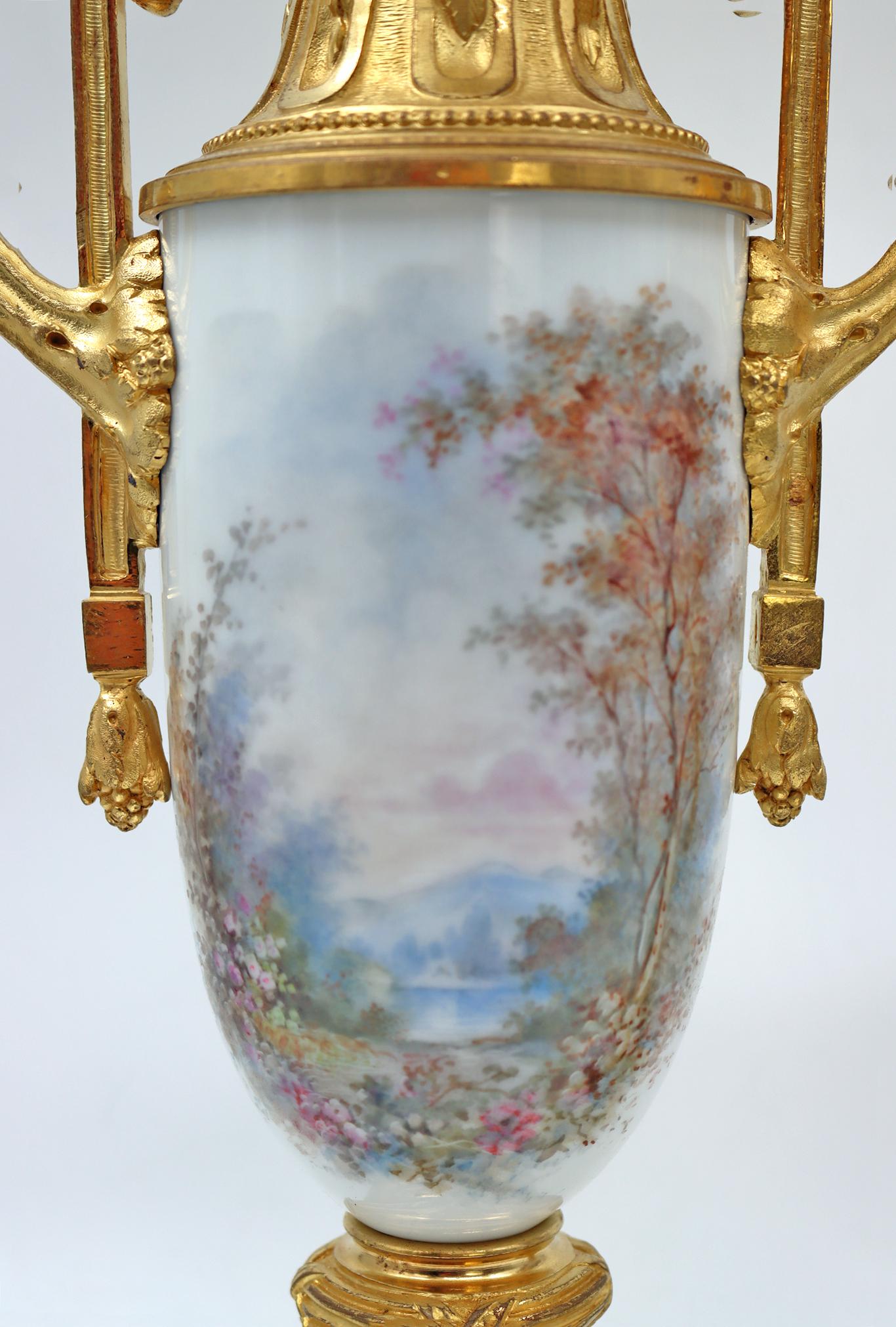 A pair of Sèvres porcelain vases, mounted with gilt bronze and Onyx base, surmounted by a crystal cup, very beautiful decoration of elegant woman and cherub, signed porcelain, Napoleon III period, 19th century
Measures: H: 51 cm, W: 17,5 cm, D: