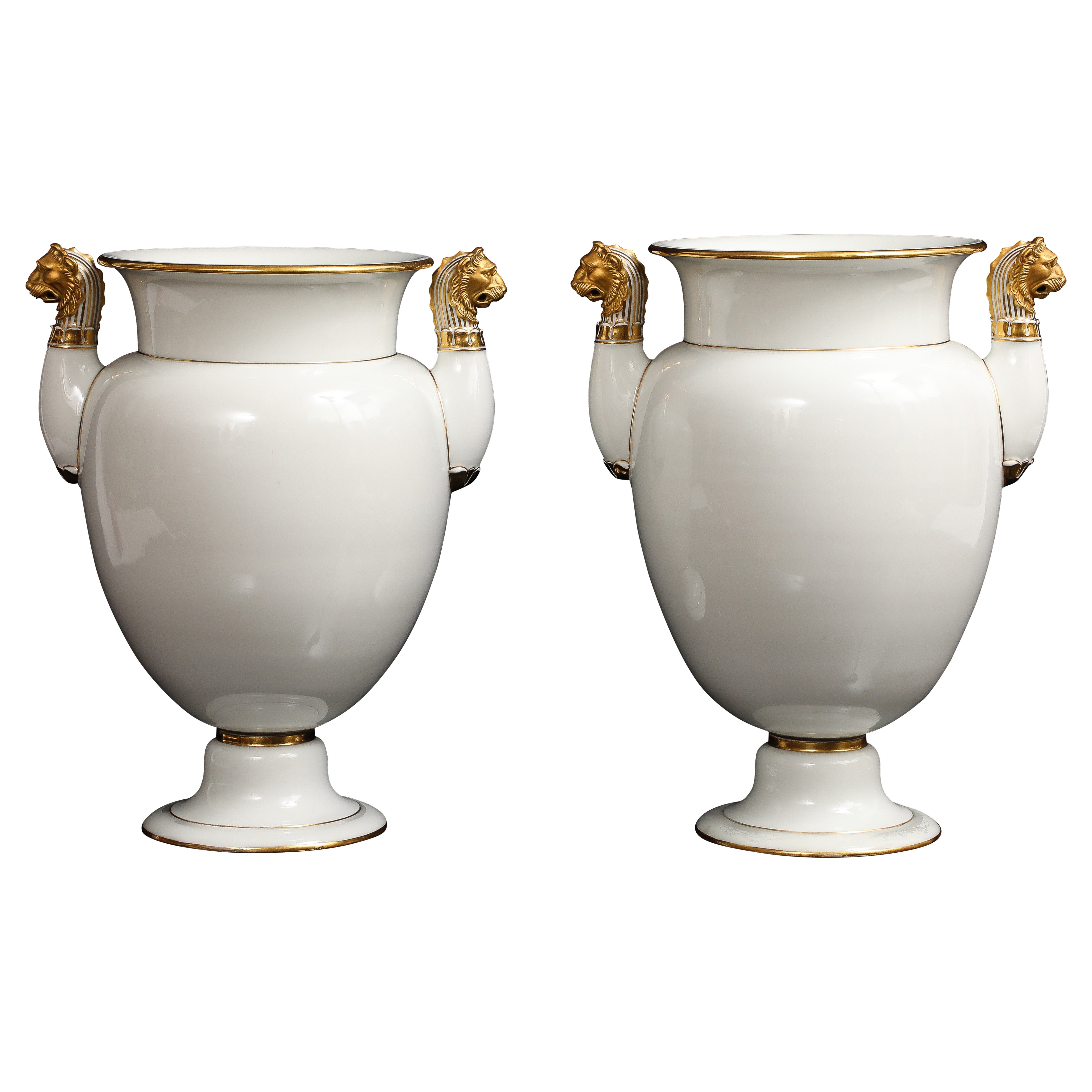 A Pair of Sevres Porcelain White Ground 
24K Gold vases w Lion Head Handles in vendita