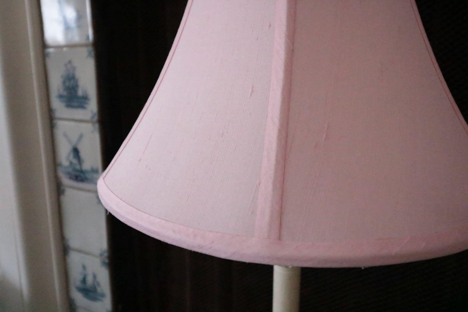 A shabby French chic pair of antiqued white and pretty pink shaded table lamps. Stunning on a bedside table or a buffet. Anywhere these extra tall shabby lamps will create a warm and inviting environment.

Height is with shade 32