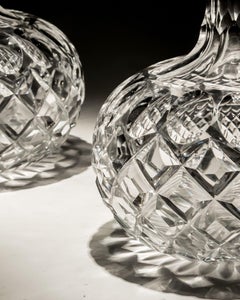 A pair of shaft and globe Victorian decanters