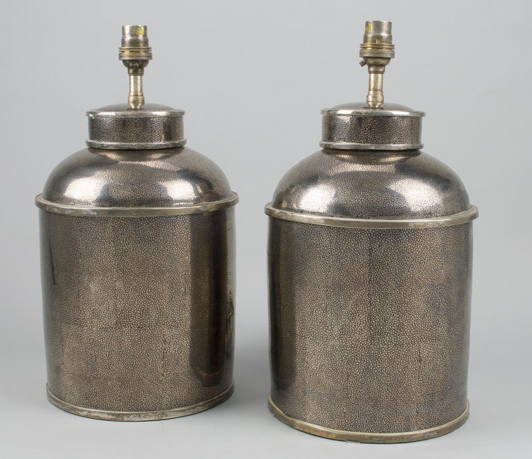Fine pair of large Chinese silver shagreen porcelain tea canisters, now mounted as table lamps.

Height of Canister: 14 1/2 in (37 cm)

All of our lamps can be wired for use worldwide.

We can supply a selection of card, linen or silk