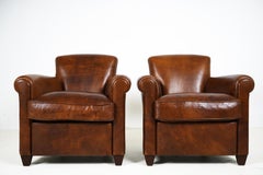 A Pair of Sheep Skin Leather Club Chairs