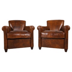 A Pair of Sheep Skin Leather Club Chairs