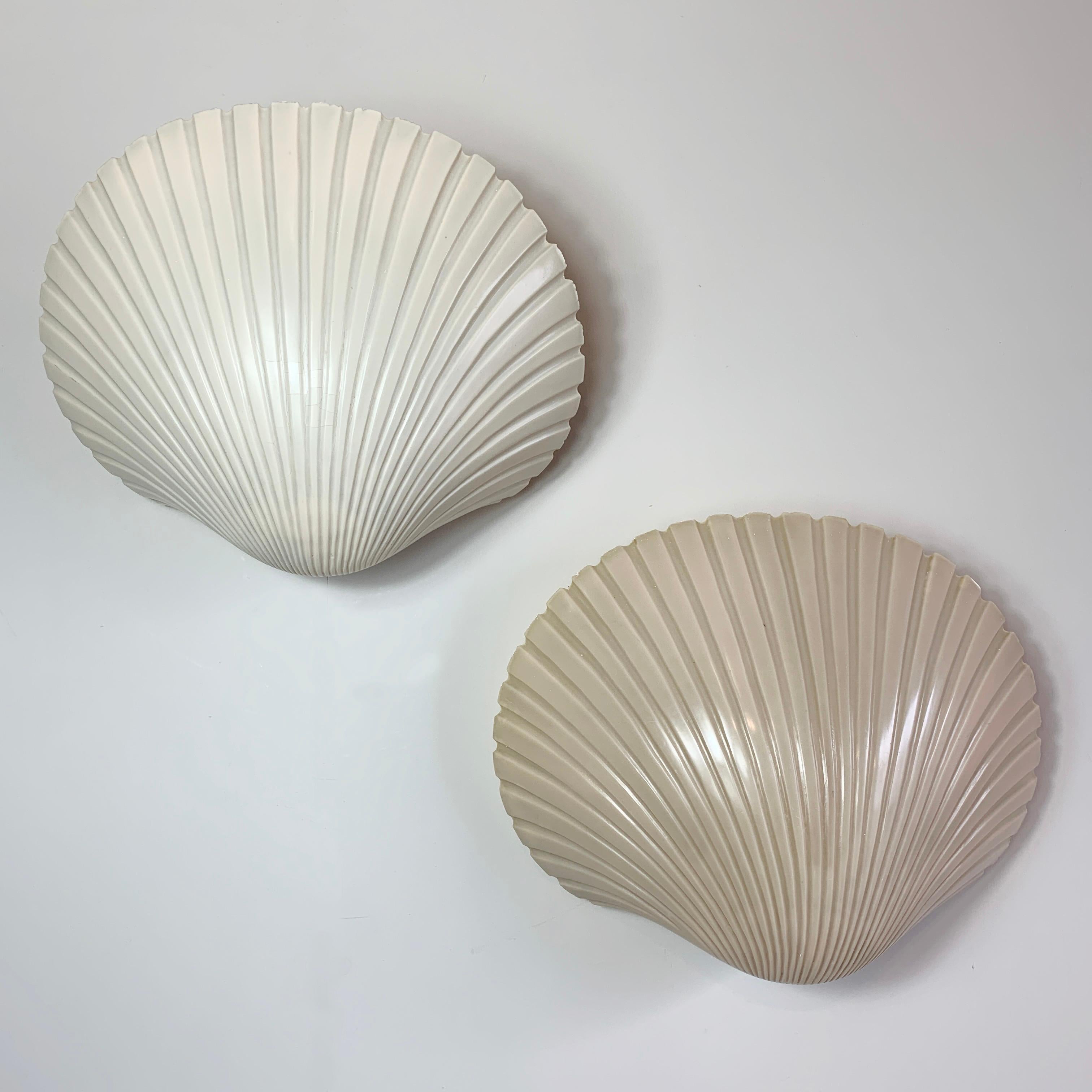 A wonderful pair of wall lamps in the form of shells by Michèle Mahé and André Cazenave for Atelier A, dating to the late 1960's the beautiful organic design is made from fibre glass.

Each lamp is unique and have slightly different colour finishes