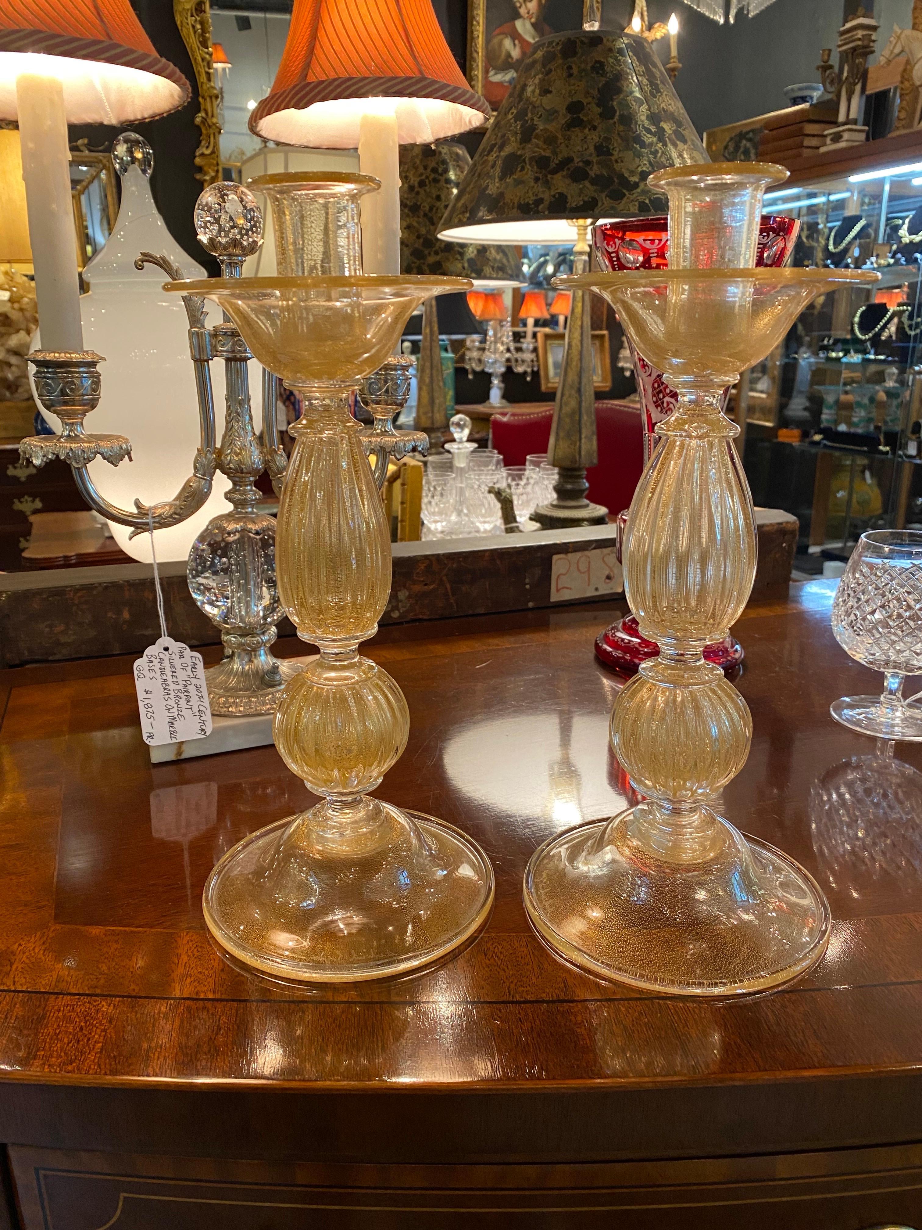 A spectacular pair of mid 20th Century vintage Murano hand blown candlesticks with gold flecks Italian art glass Documented to designer Archimede Seguso, circa 1950s. It has original label still attached to the top and at the it is engraved on the