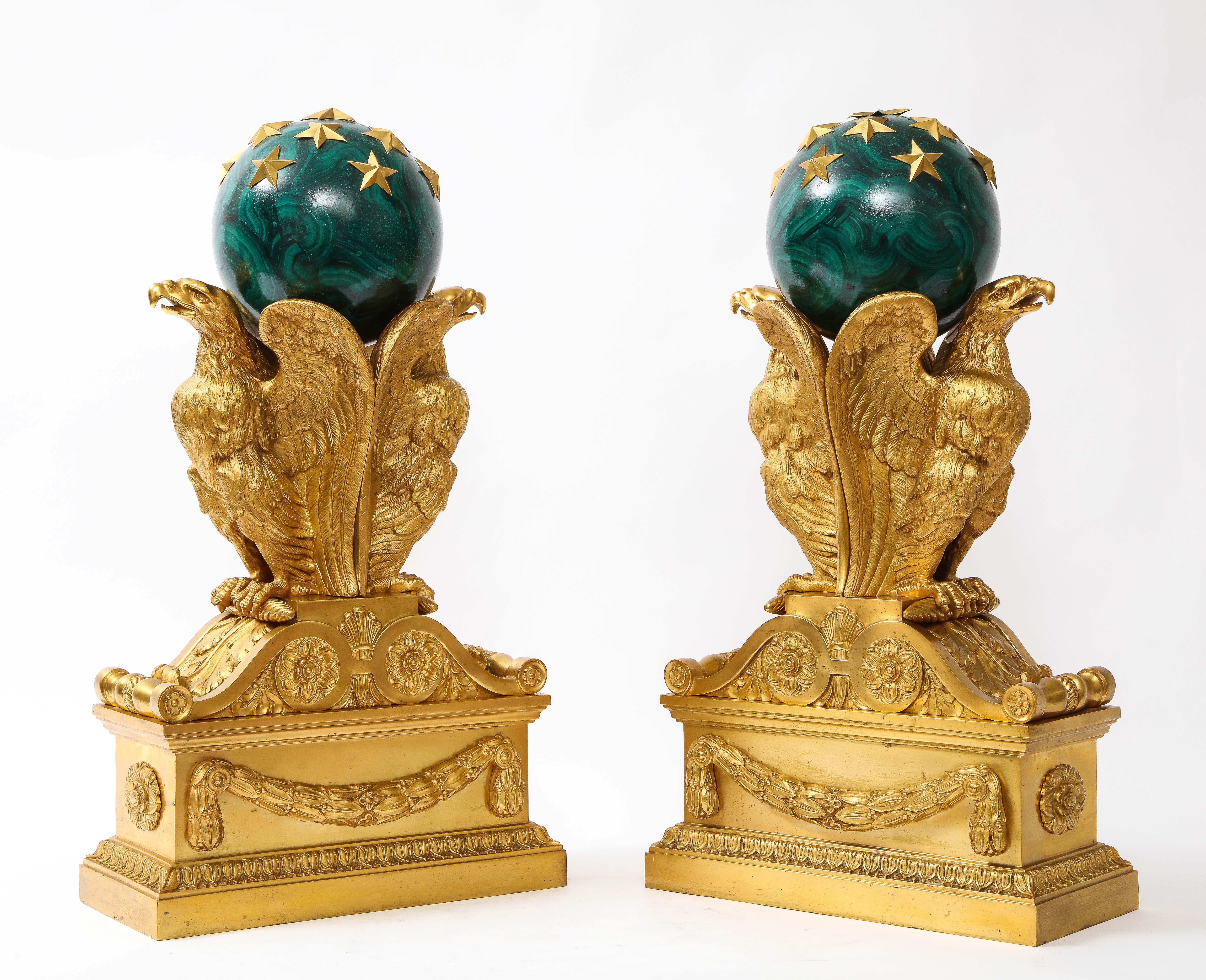 A Unique,  Rare, and signed Pair of 19th Century French Ormolu Double Eagle Andirons with Faux Hand-Enameled Bronze Malachite Globes Enhanced with Ormolu Stars.  Each is beautifully cast with a tremendous amount of detail.  The unusual andirons are