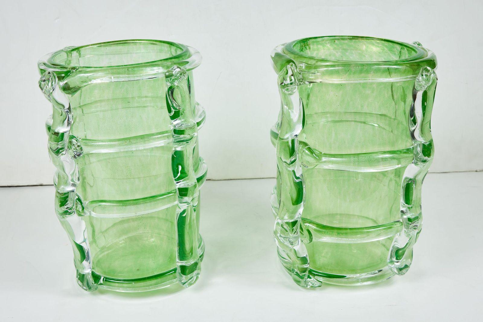 Beautiful pair of hand-blown Murano vases surrounded by ribbed extrusions. The body in a sublime Spring green hue, and each flecked with 24k gold. Both signed, 