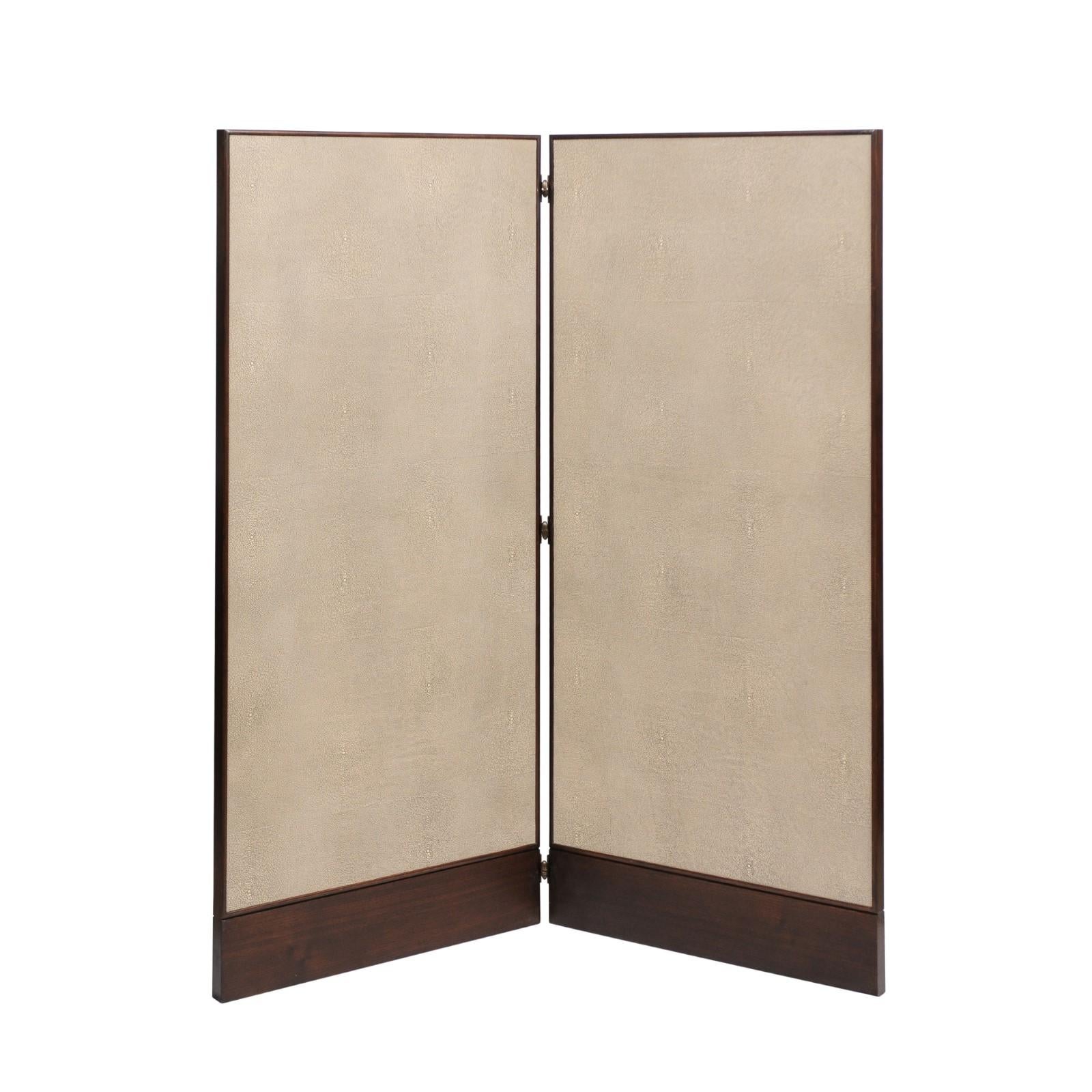 A Classic and rare collaboration between Barbara Barry and Baker Furniture: the Silent Veneer and Shagreen Screen. This listing is for a pair of screens. The nougat colored shagreen is framed within a brunette finish veneer, and both the veneers and