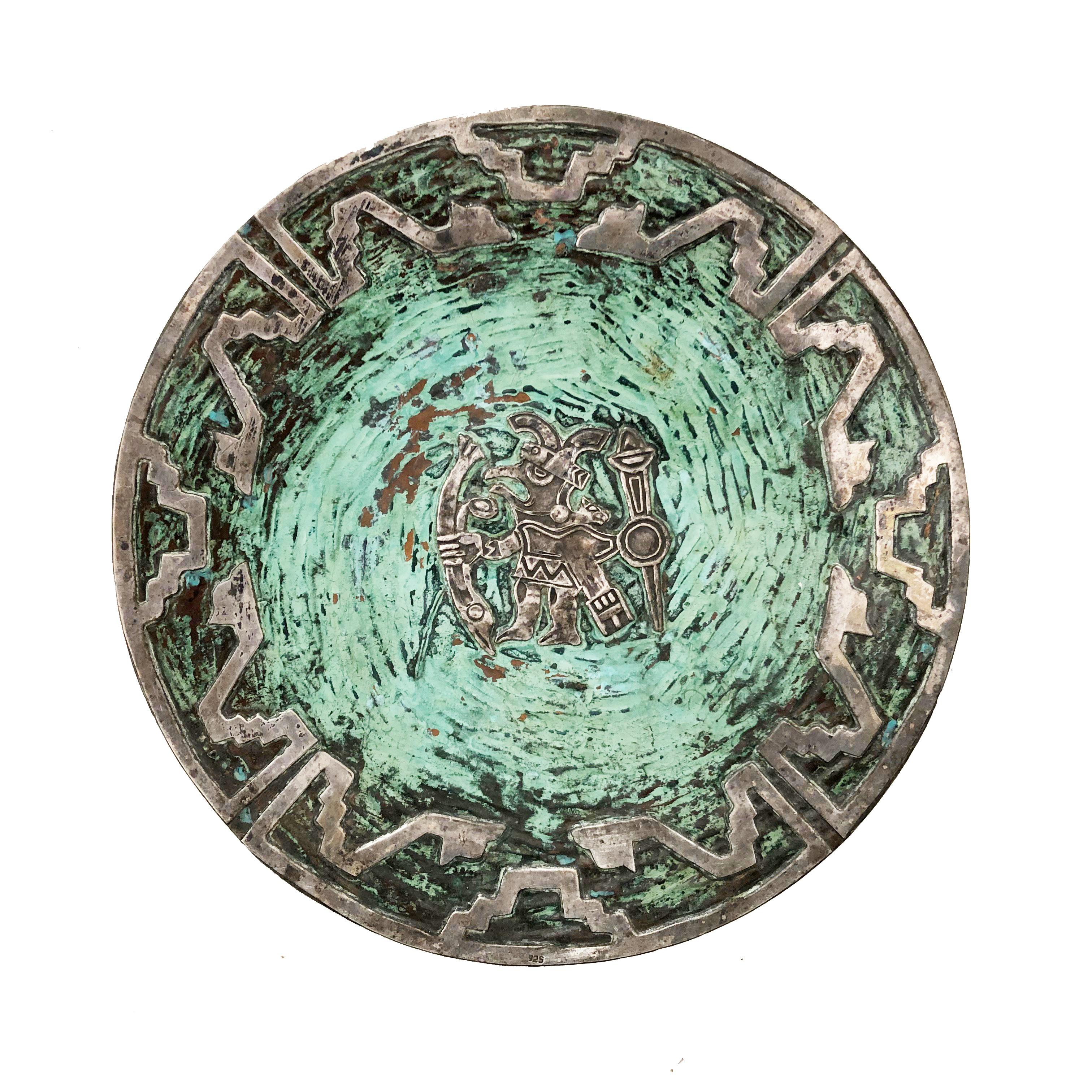 Silver and turquoise on copper plates attributed to Graziella Laffi with images of a warrior god and llama. Unsigned. Wonderful patina.