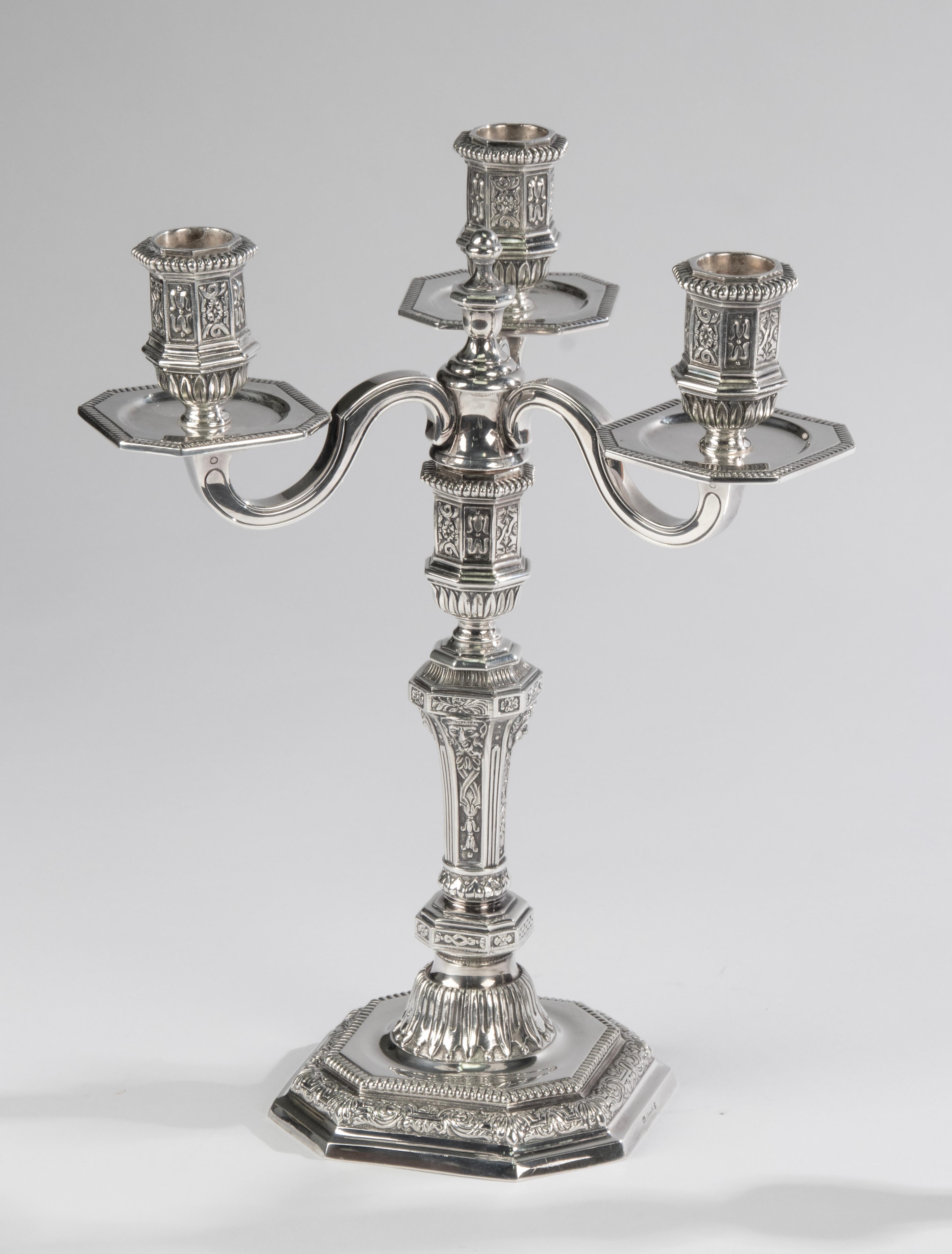 A great set of 2 silver plated candelabras, made by the French brand Christofle. 
The candelabras are designed by Louis Dupérier in renaissance style. 
Very refined, with many detailed decorations. 
Each candle has place for three candles. The top