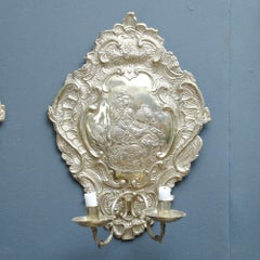 A Pair Of Silvered Wall Sconces