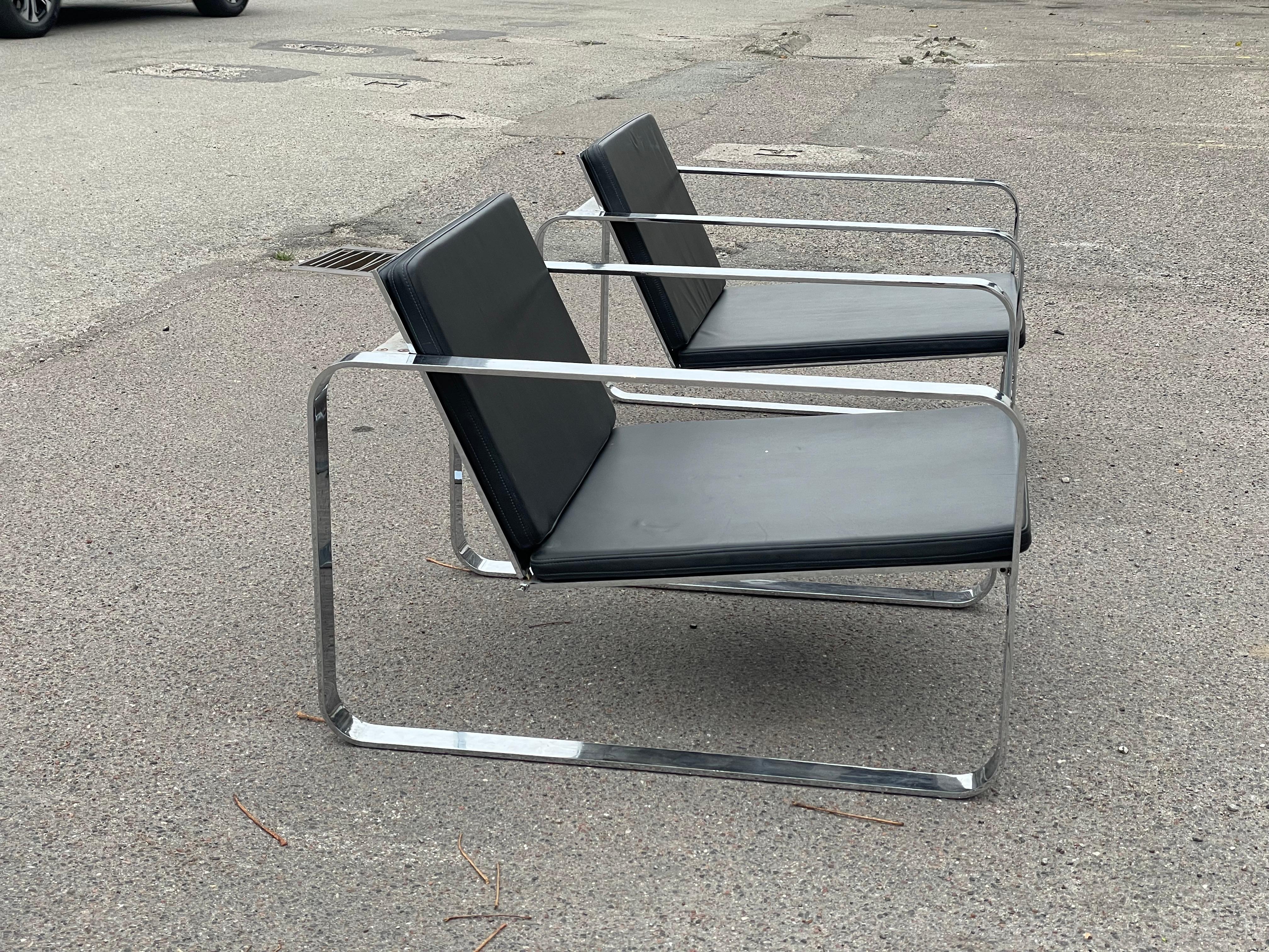 A pair of Silverstone Chairs designed by Danish designer Morten Voss in 1999 1