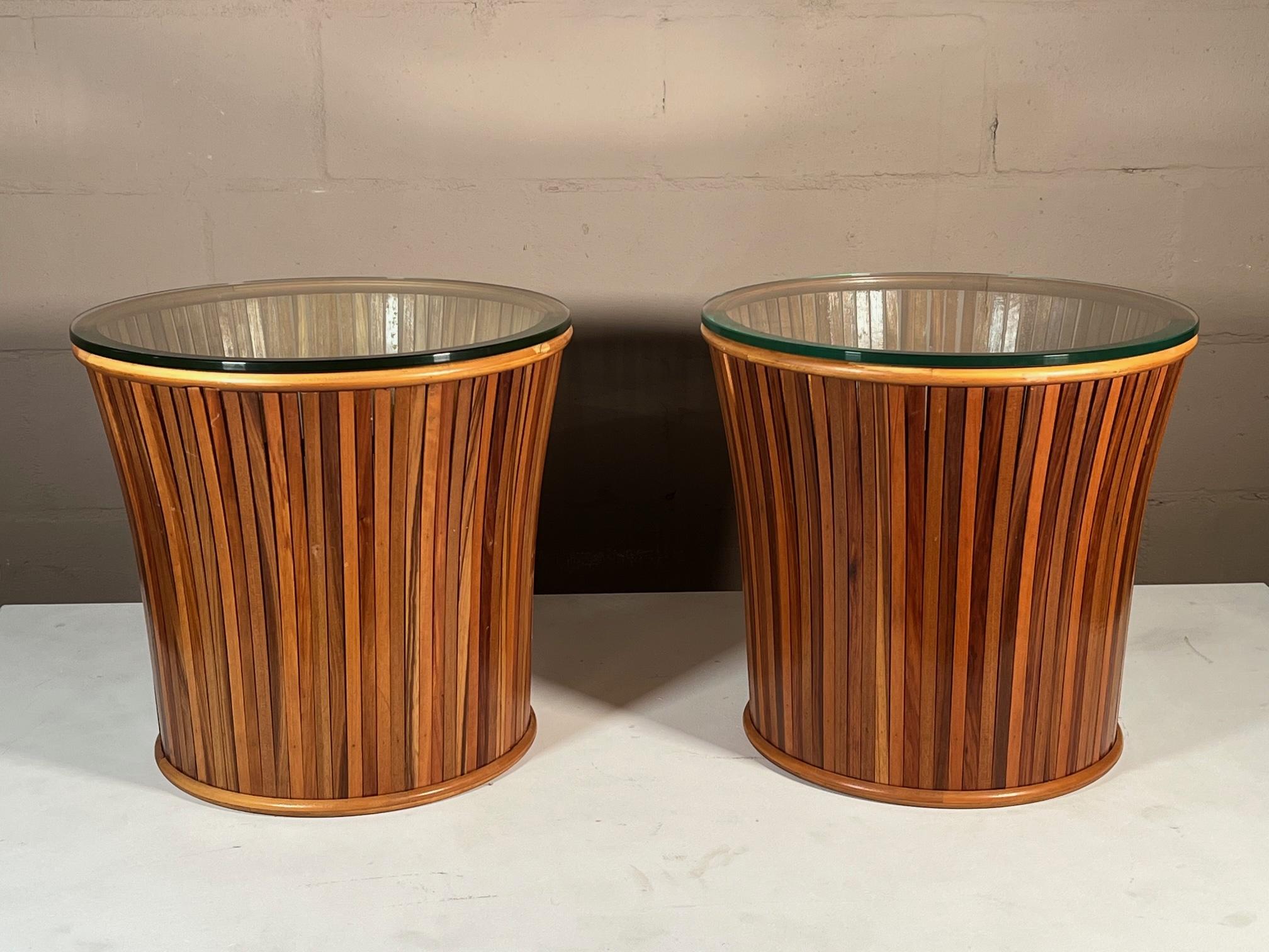 A pair of very unusual slat and reed side tables or pedestals with glass tops. Ca' 1970's, drum shaped, wider at the top.
