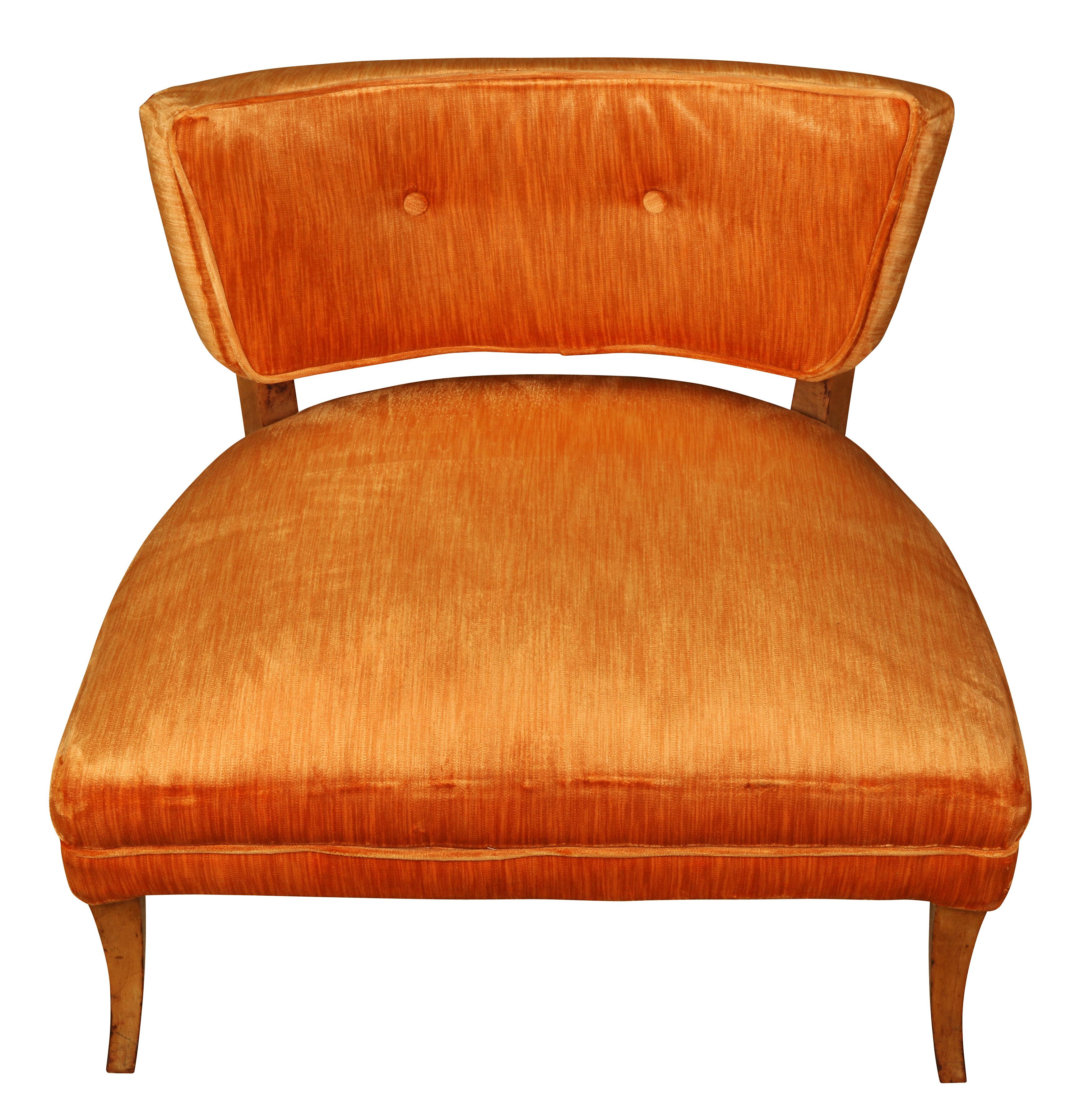 Attributed to Hollywood designer Billy Haines, this pair of low slipper chairs ooze with style and glamour. With a tufted back, wide low seat and slightly splayed legs, the chairs are comfortable as well as versatile and can be easily added to any
