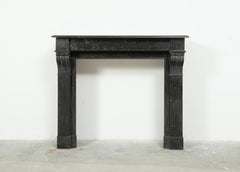 A Pair of Small Black Marble Antique Fireplaces