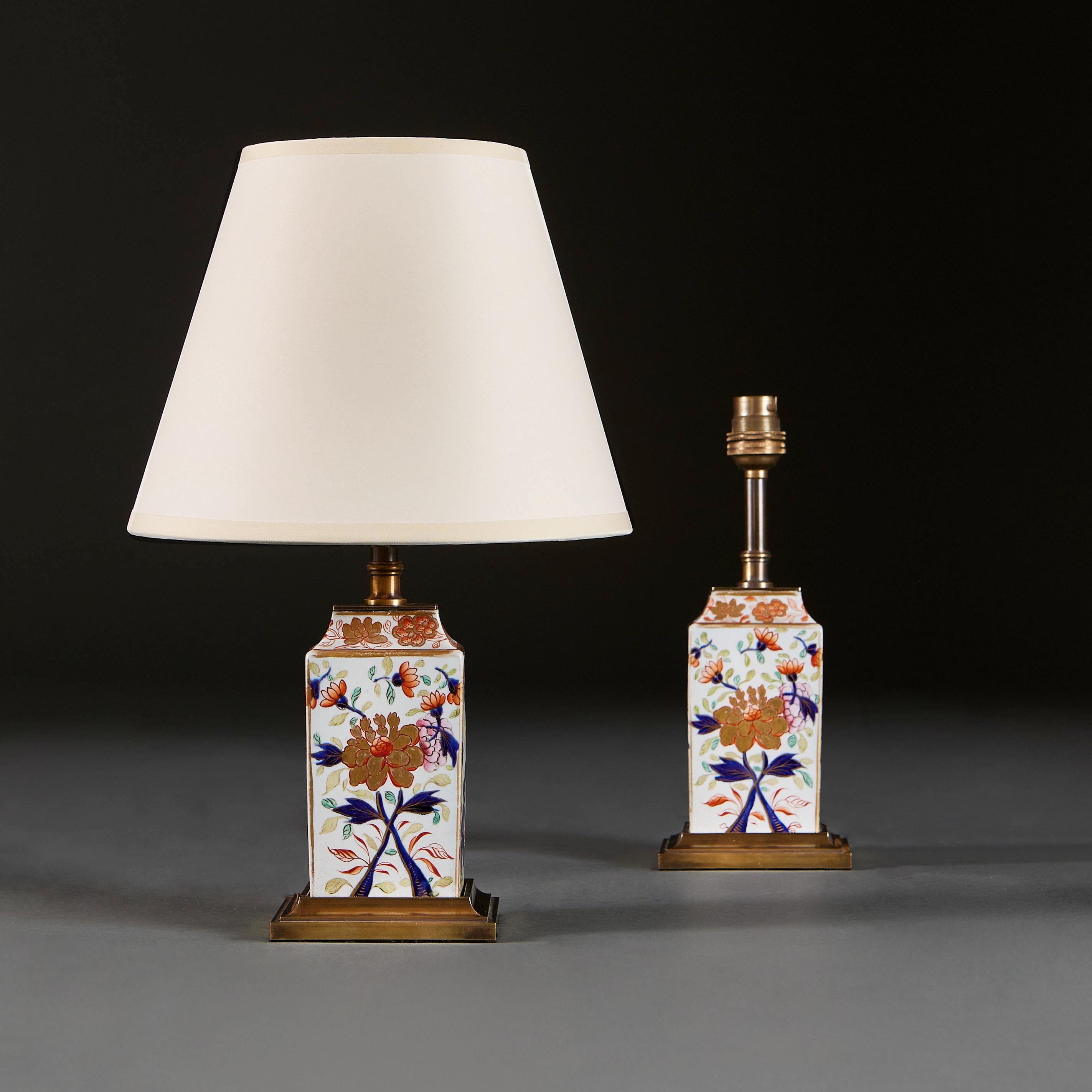 Japan, circa 1850

A pair of small mid 19th century Imari vases of square form, with oriental floral motives throughout, now mounted as lamps on brass plinth bases.

Height of vase 15.00cm
Height with shade 34.00cm
Width of base