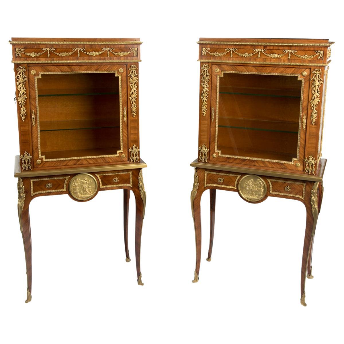 A pair of small Napoleon III kingwood display cabinets on stands For Sale