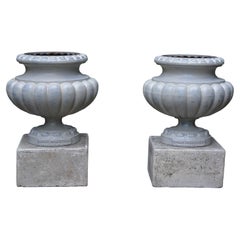 Pair of Small Steel Grey Cast-Iron Urns