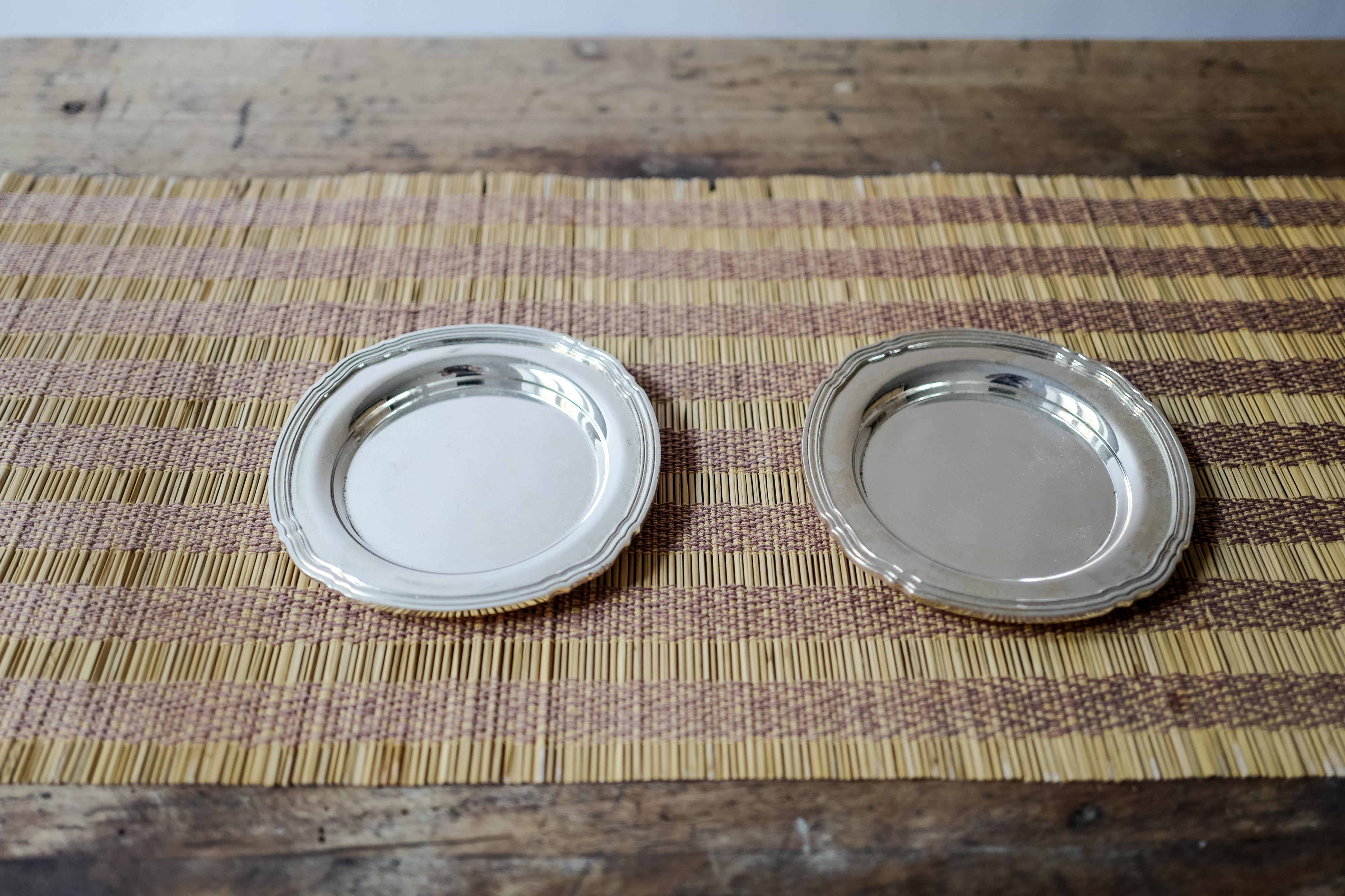 A beautiful vintage pair of small Christofle France silver plated round bread plates from France circa 19th Century. Hallmarked Christofle. 