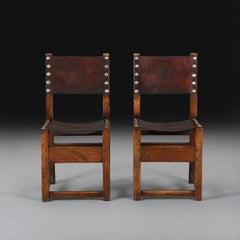 A Pair of Spanish Oak Hall Chairs