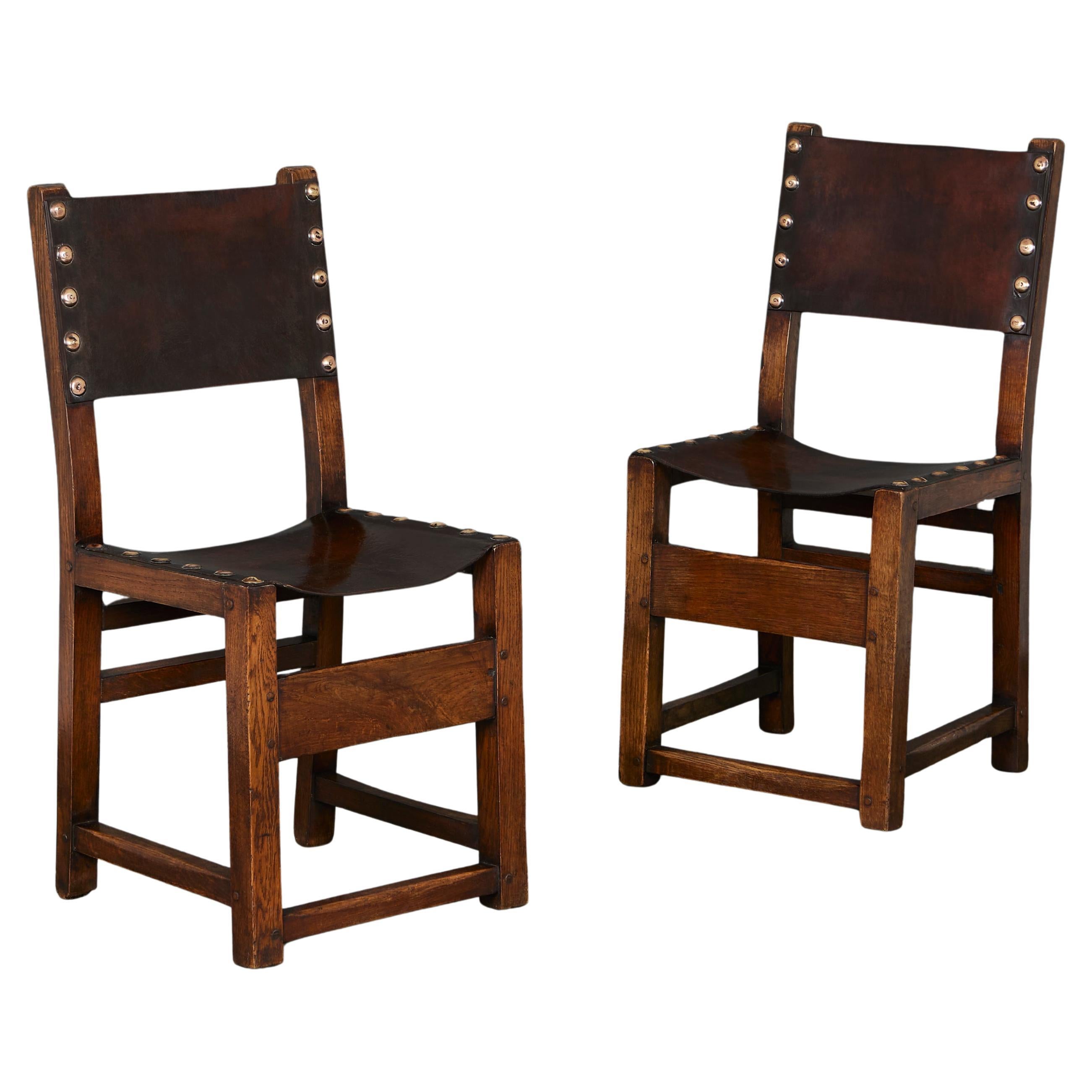 A Pair of Spanish Oak Hall Chairs