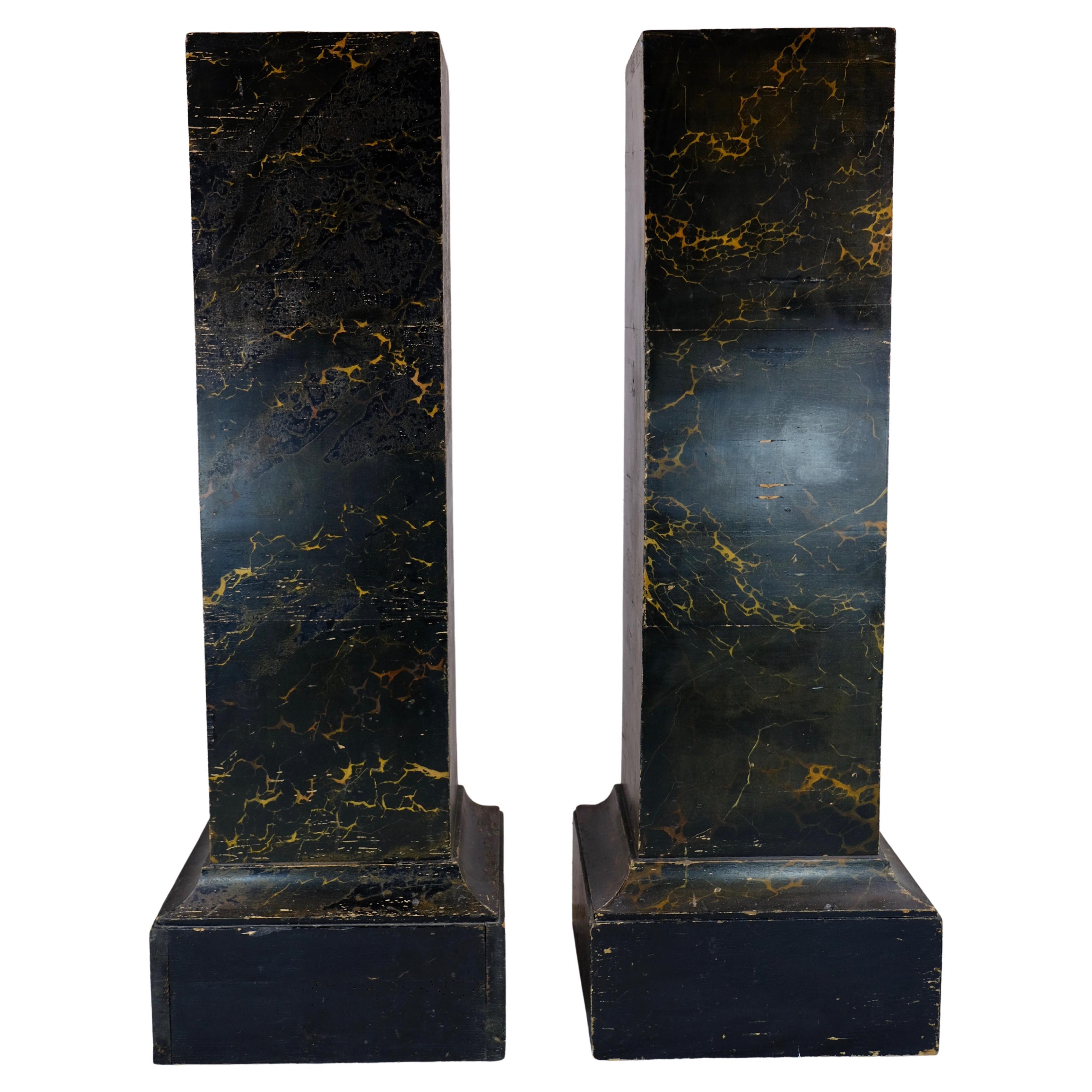 A pair of pillars made of wood and painted in marble imitation (original). Made around year 1800. These pillars are great in any interior to put sculptures, candelabras or anything else on.