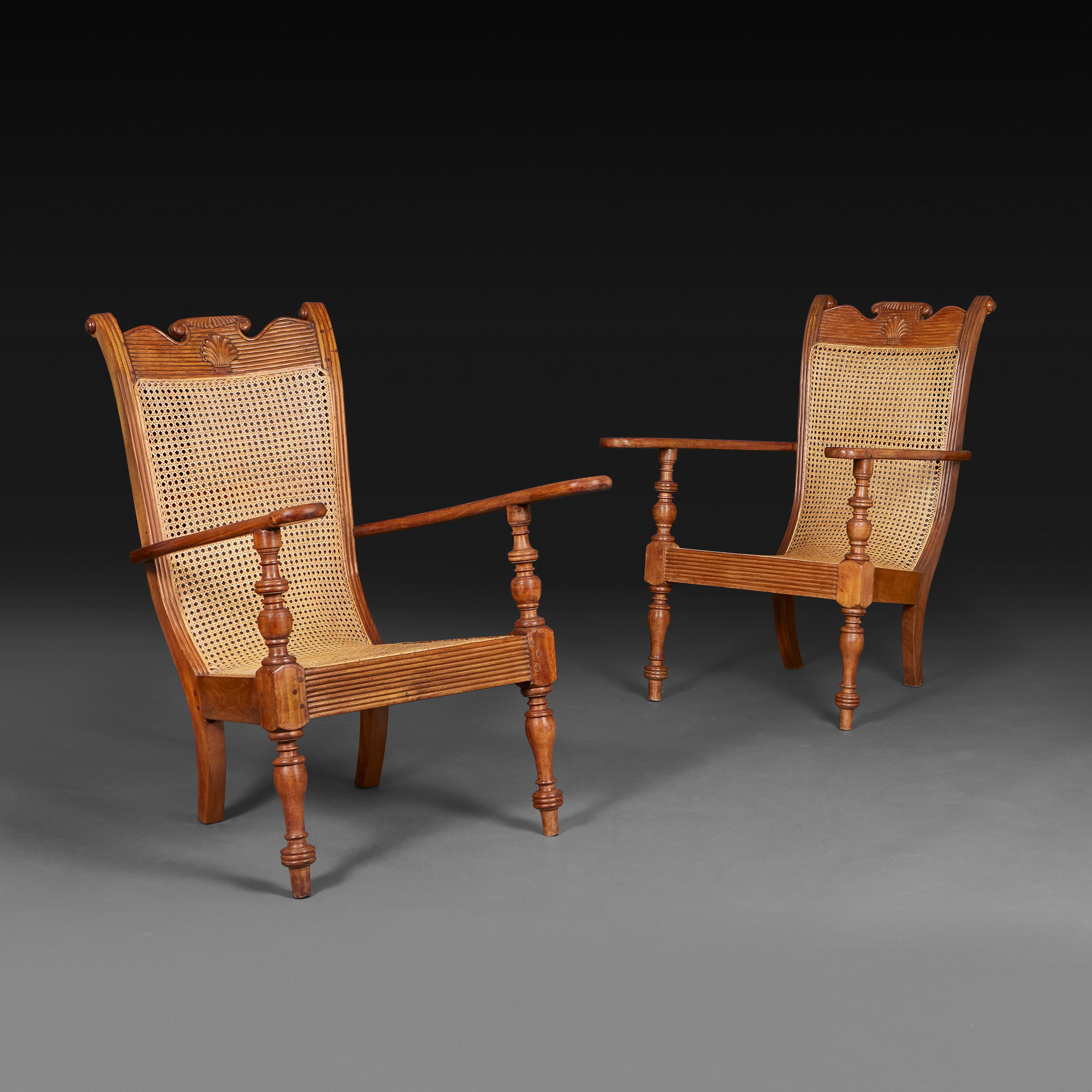 Sri Lanka, circa 1920

A pair of 20th century Sri Lankan sling back planters chairs in the British colonial style, the frames in solid teakwood with a shell motives carved to the backrest and the seats with their original caning. 

Height   
