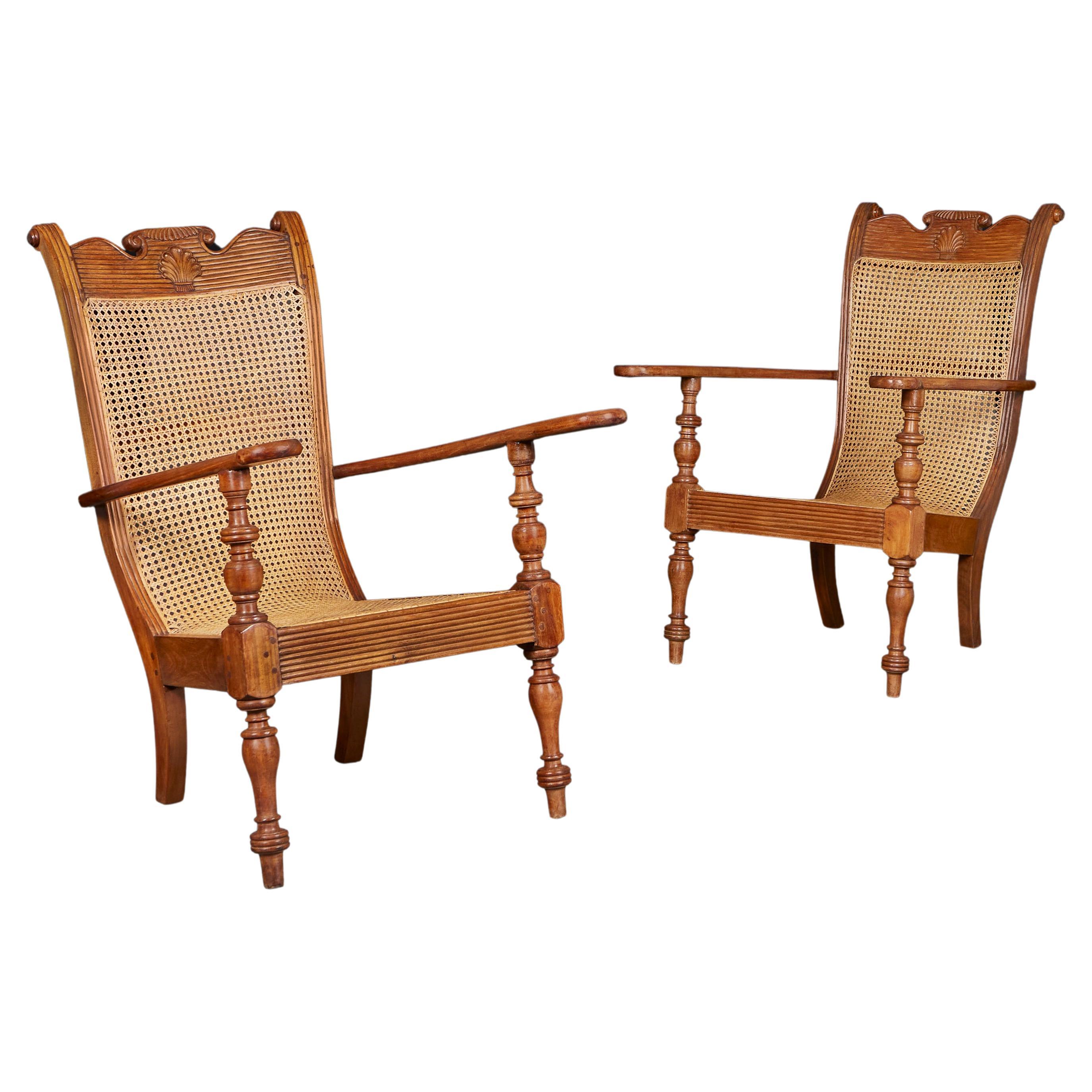 A Pair of Sri Lankan Teak and Cane Planters Chairs 