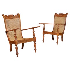 Vintage A Pair of Sri Lankan Teak and Cane Planters Chairs 