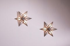 A pair of star-shaped wall sconces made of steel and glass, Italy, 1960s