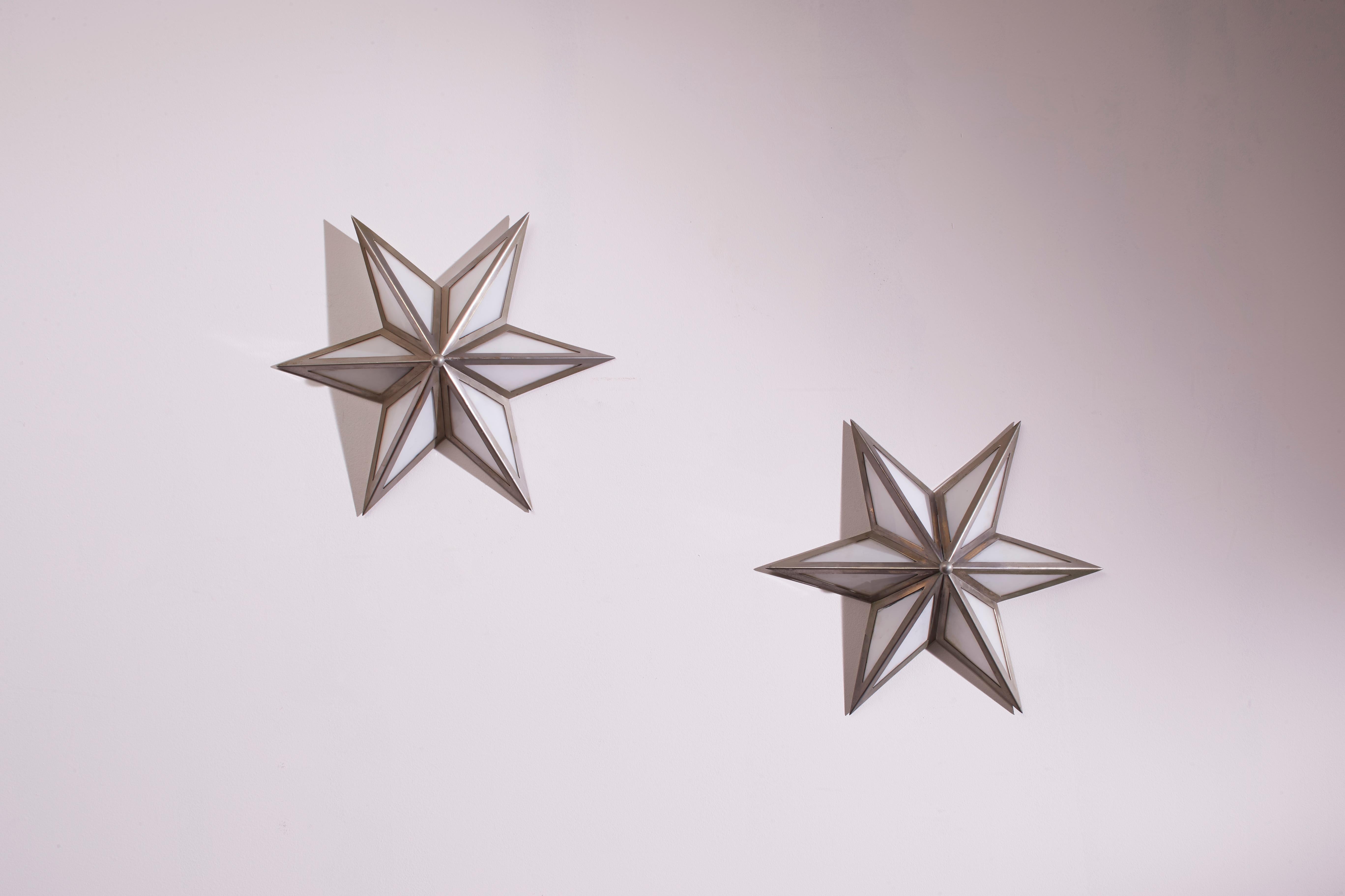 Mid-Century Modern A pair of star-shaped wall sconces made of steel and glass, Italy, 1960s