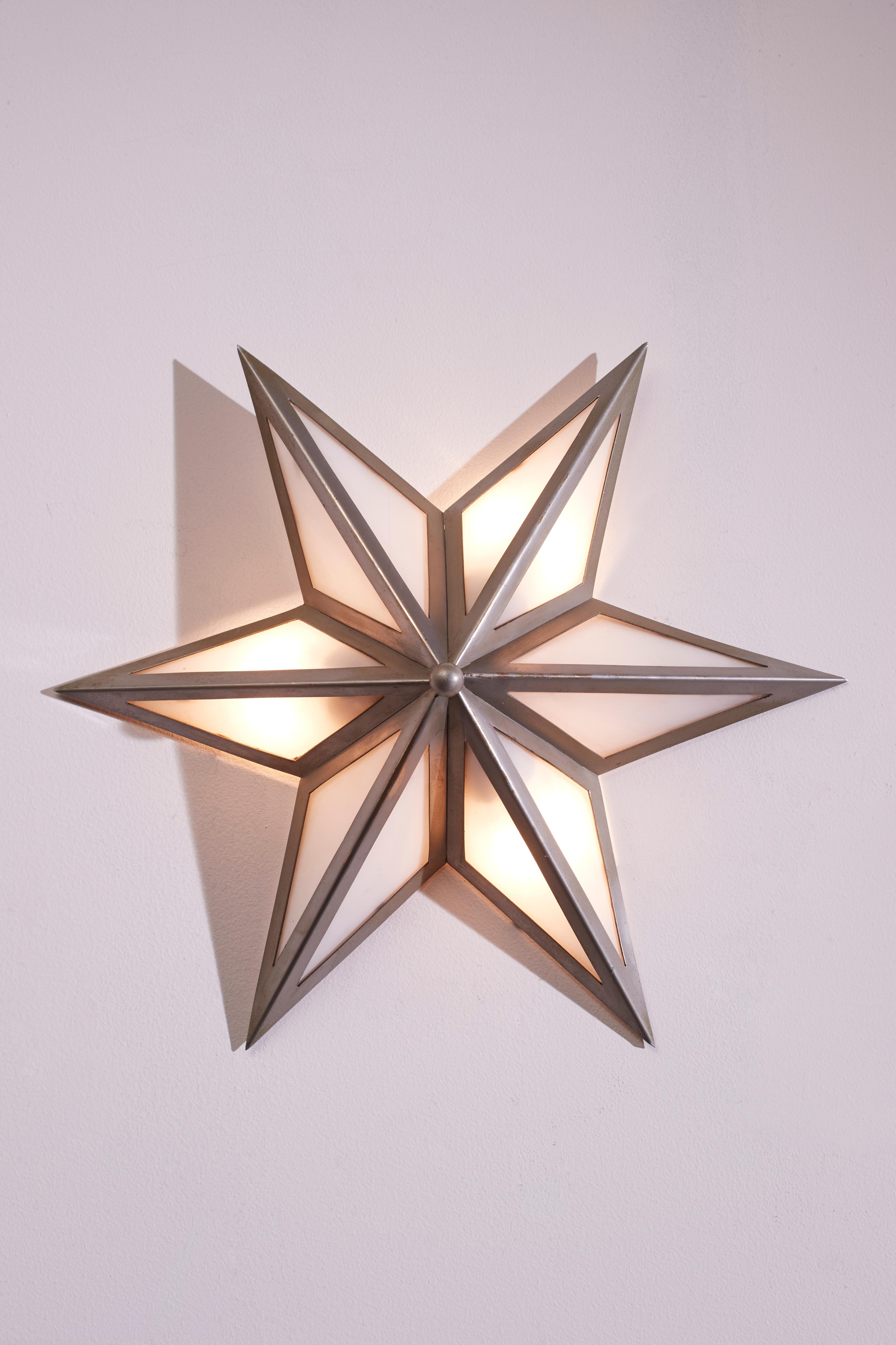 Italian A pair of star-shaped wall sconces made of steel and glass, Italy, 1960s
