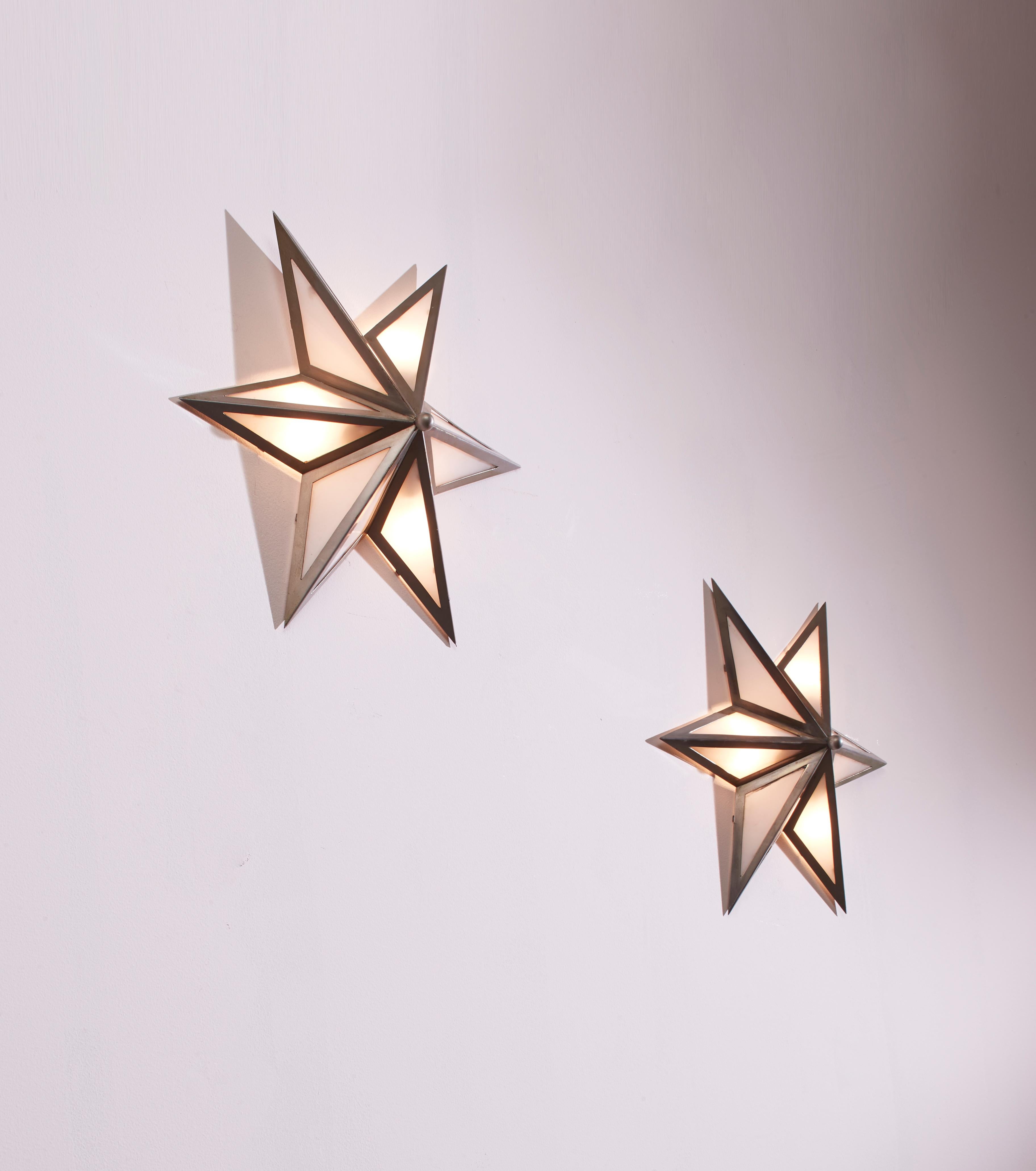 Mid-20th Century A pair of star-shaped wall sconces made of steel and glass, Italy, 1960s