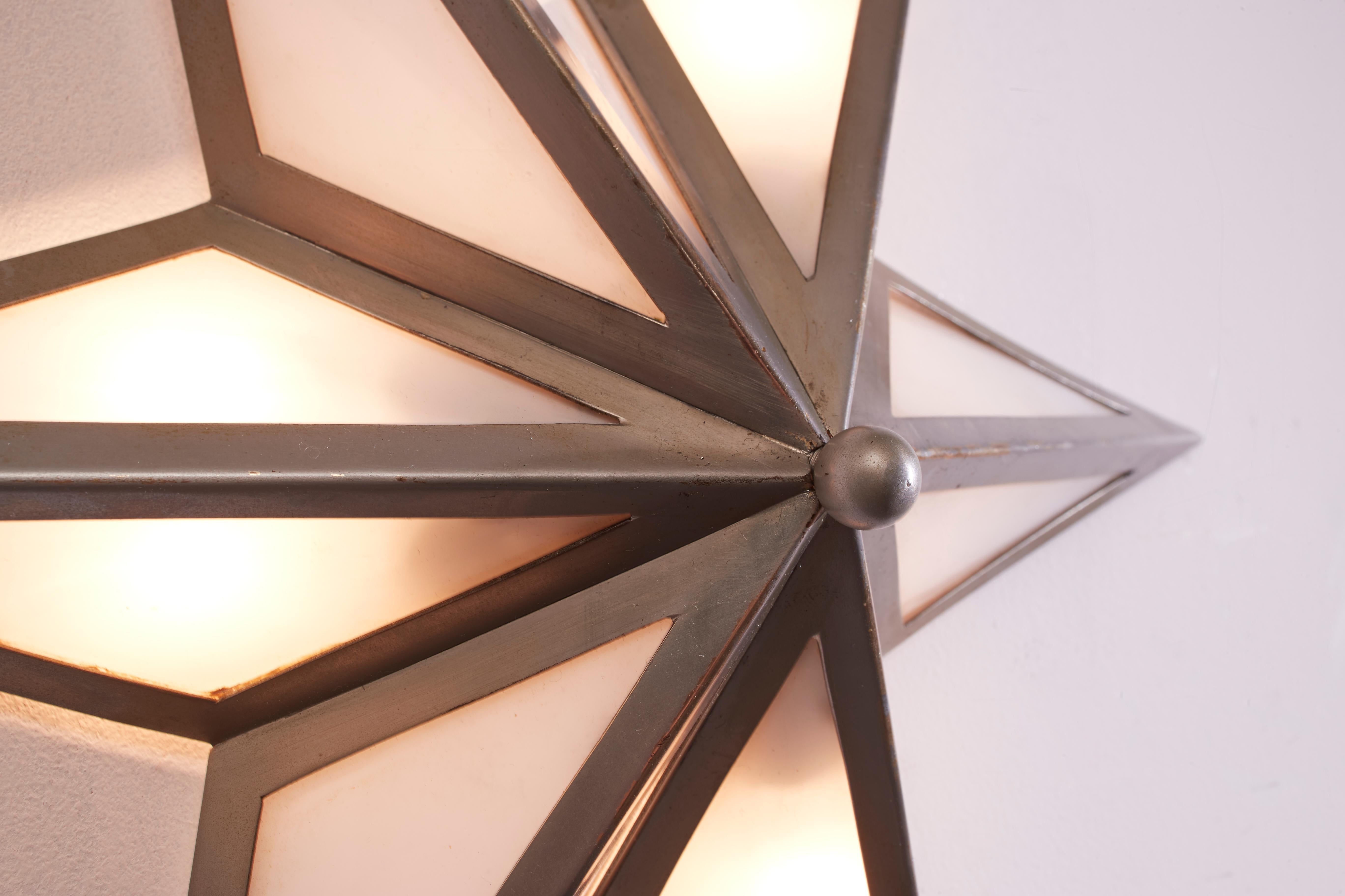 A pair of star-shaped wall sconces made of steel and glass, Italy, 1960s 2