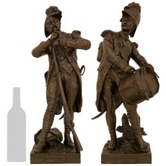 A Pair of statues named Avant Le Combat and Apres Le Combat, signed by Dumaige