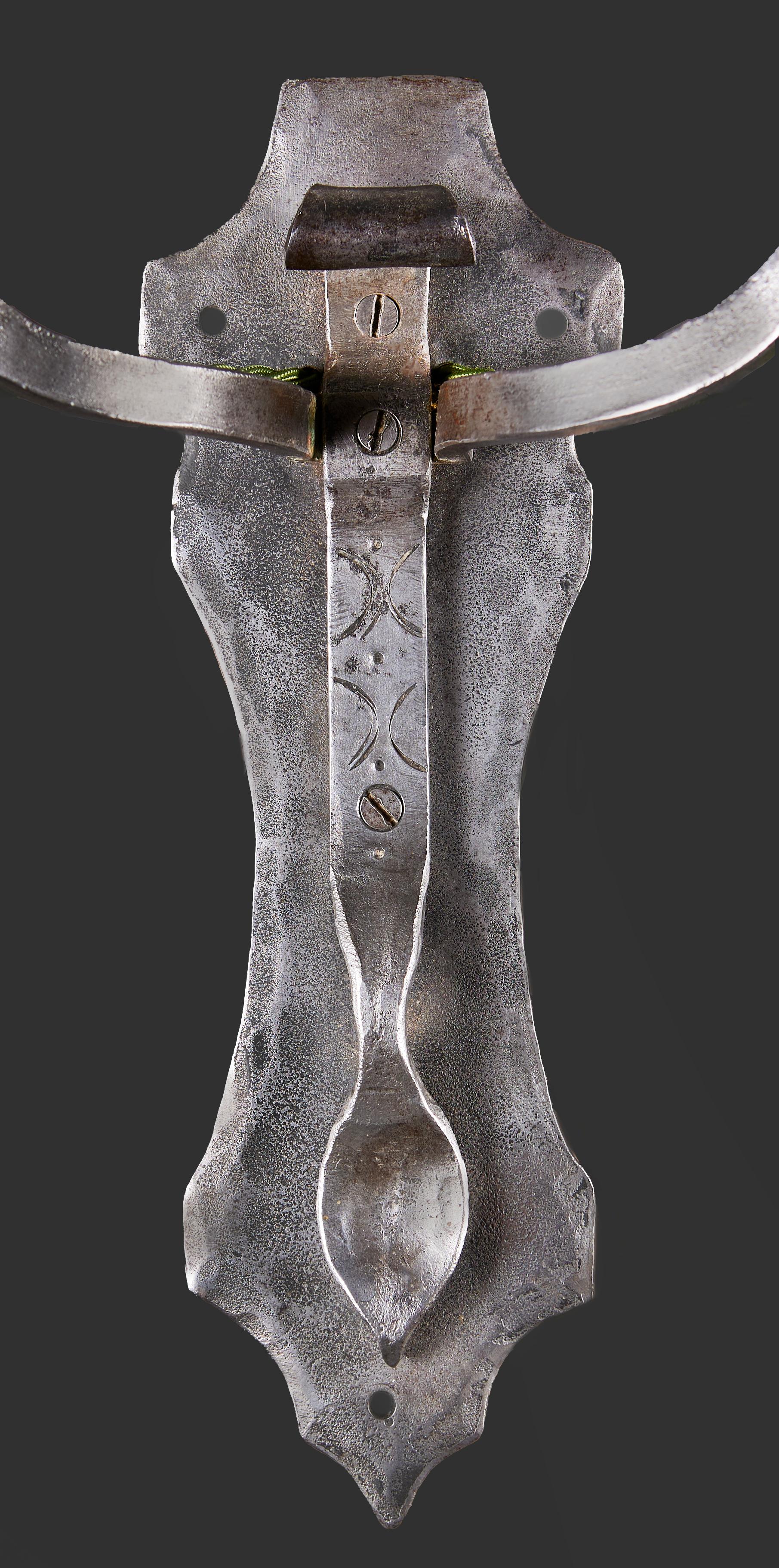 England, circa 1900

A pair of unusual steel Arts and Crafts wall lights, the shield form back plates with two scrolling arms, supporting hanging cables with steel petals surrounding the bulbs. 

Total height     35.00cm
Height of backplate  