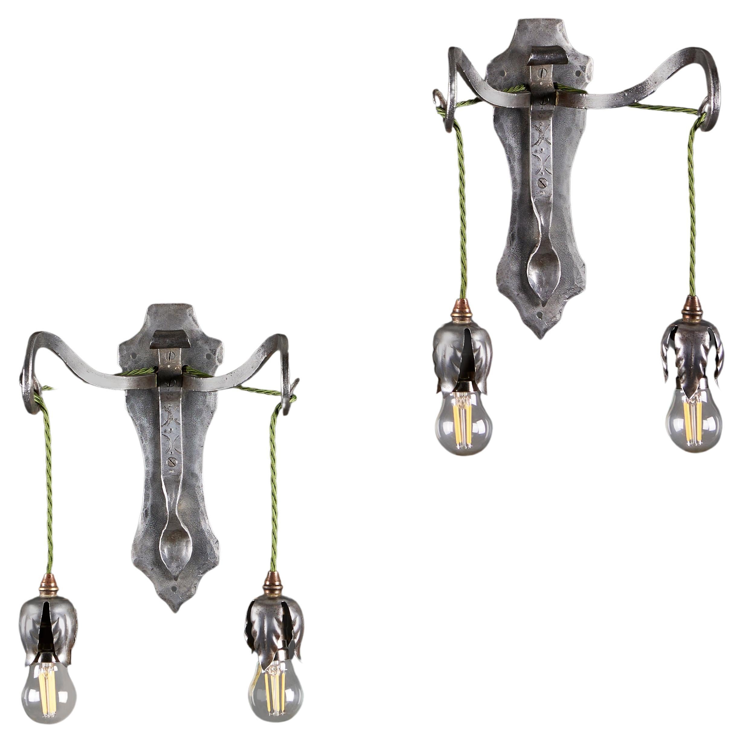 A Pair of Steel Arts and Crafts Wall Lights