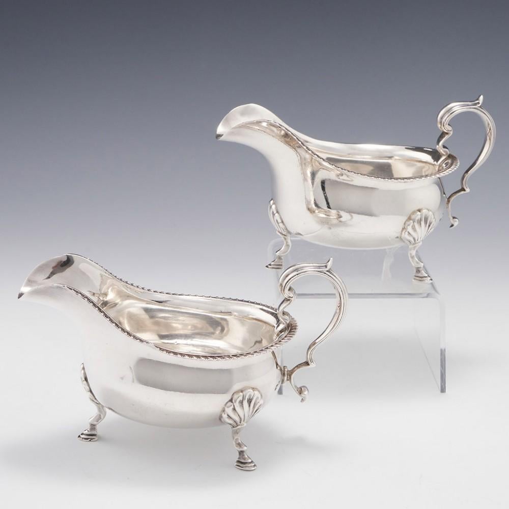 A Pair of Sterling Silver Sauce Boats London, 1930

Additional information:
Date : Hallmarked in London 1930 For Goldsmiths & Silversmiths Company
Period : George V
Origin : London England
Decoration : Pie crust rims. Scallop and hoof feet. Double C