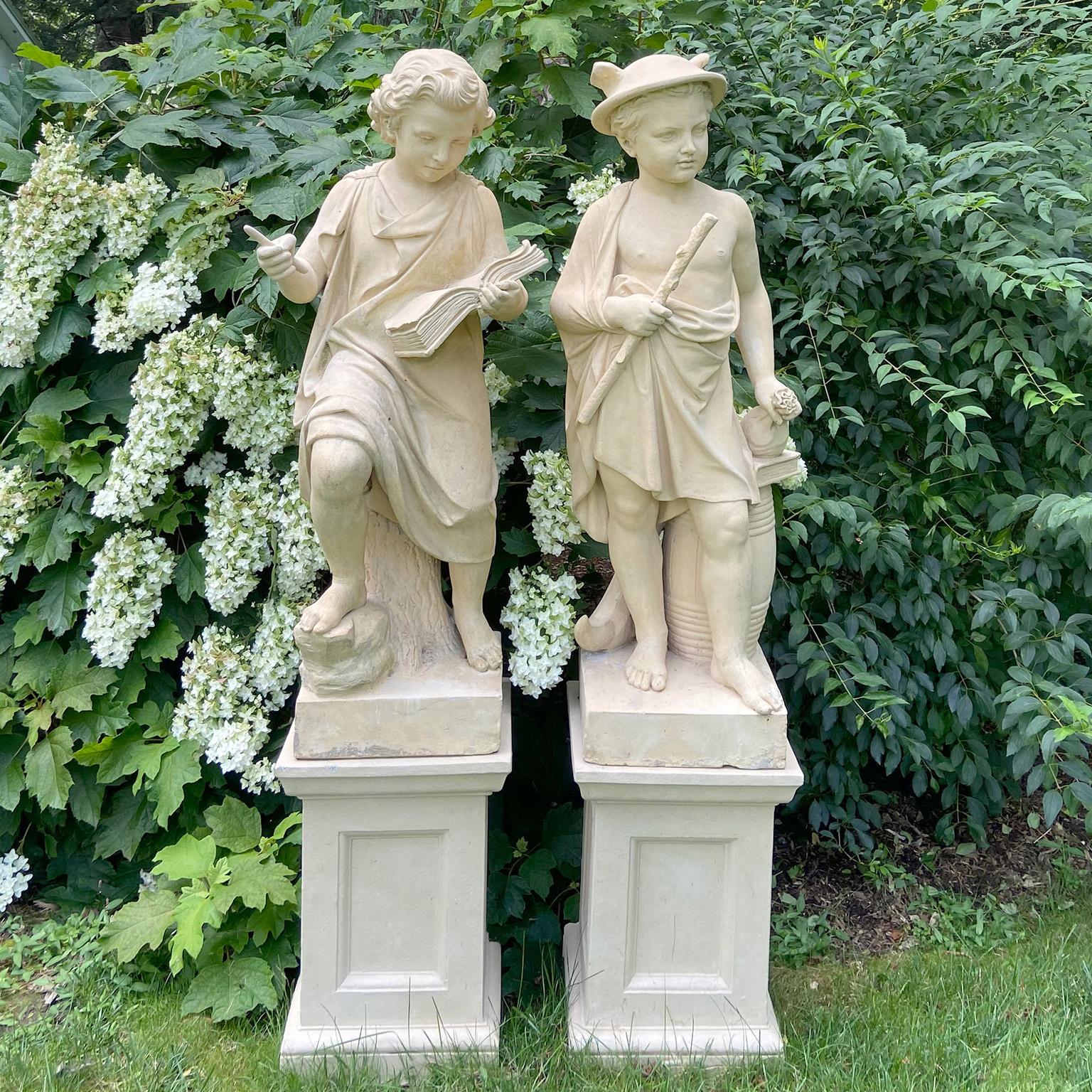 A fine and rare pair of stoneware figures representing Commerce and Knowledge, possibly produced by Doulton & Co. of Lambeth, England, the figure of Knowledge depicted as a youth, classically robed and seated on a tree trunk, with open book in