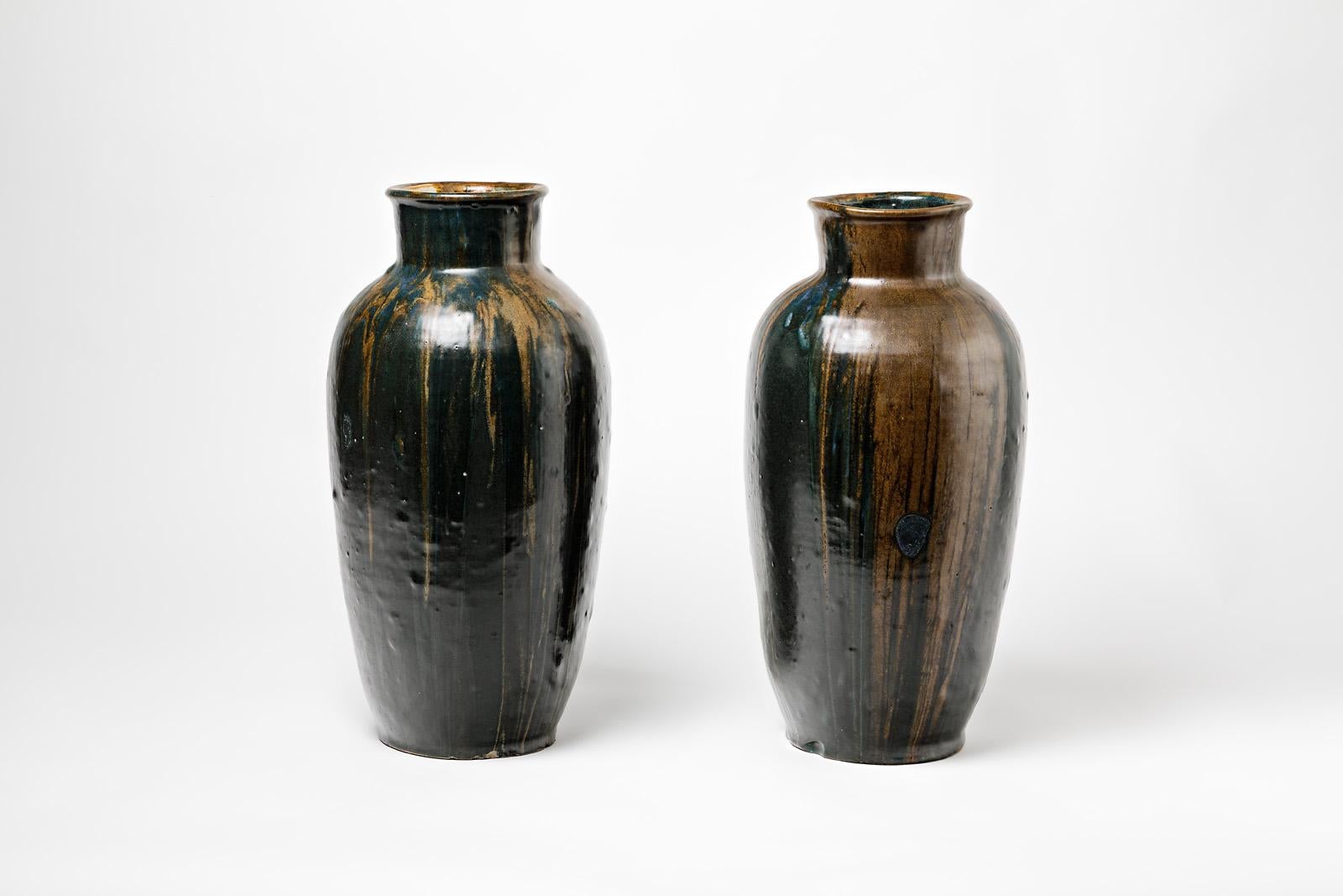 A pair of stoneware vase by Leon Pointu (1879-1942)
Perfect original conditions.
Each vase is signed under the base,
circa 1930.
  
