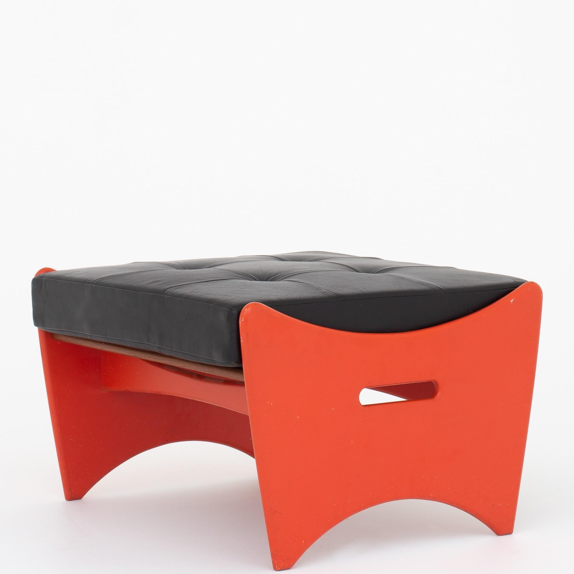 Stool in orange-lacquered beech with black leather cushion. One piece. Unknown Danish architect.