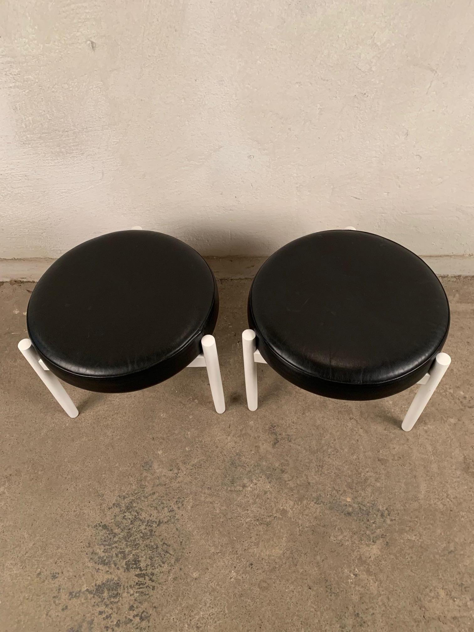 A pair of Danish stools, designed by Hugo Frandsen, Spottrup from the 1960s. In original condition and signed. Seats made of high quality leather. The frame and legs are made of ashwood. Stools are a Classic Danish design.